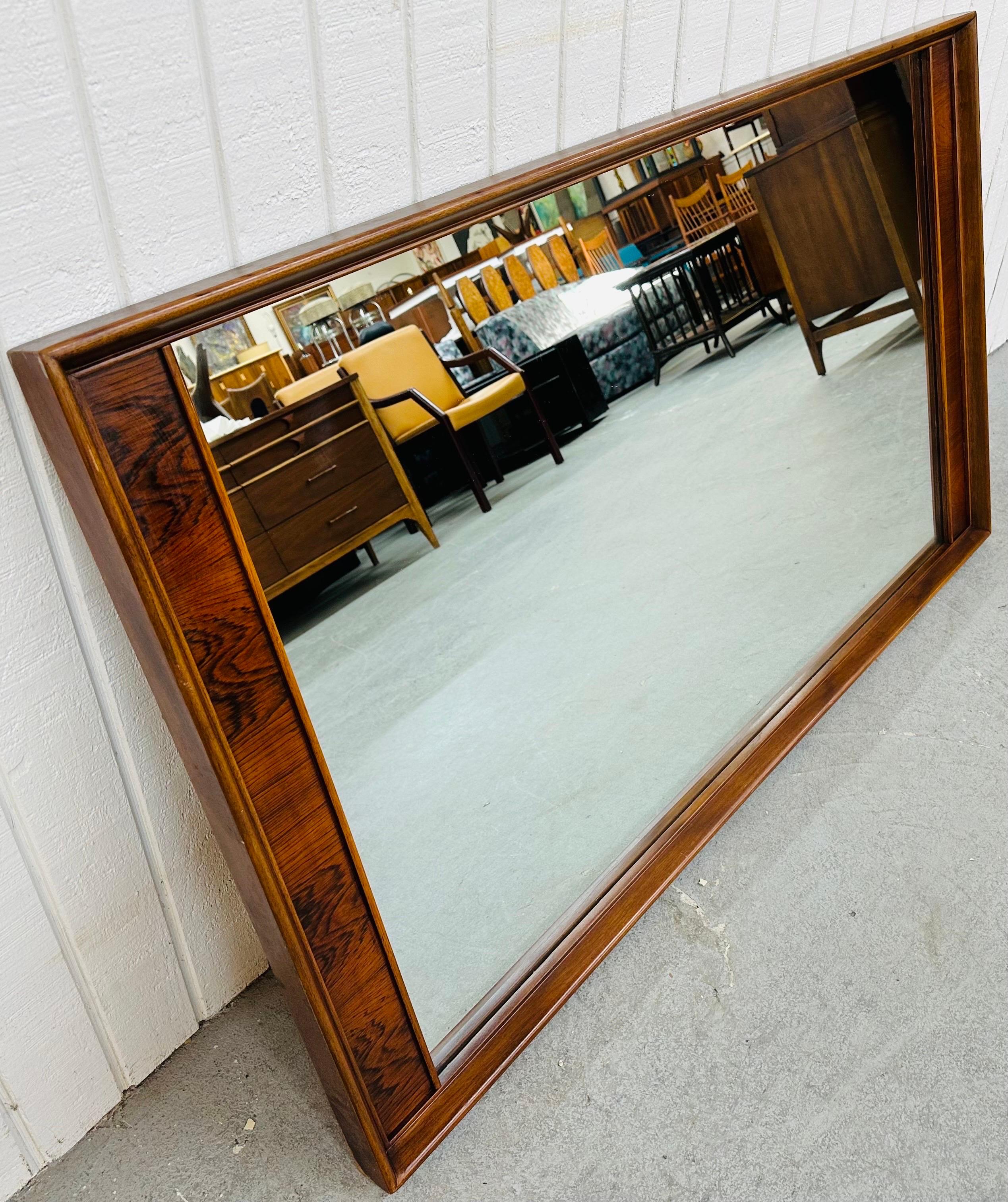 This listing is for a Mid-Century Modern Kent Coffey Perspecta Large Wall Mirror. Featuring a straight line rectangular design, solid wood frame, rosewood accent on each side, and a beautiful walnut finish. This is an exceptional combination of