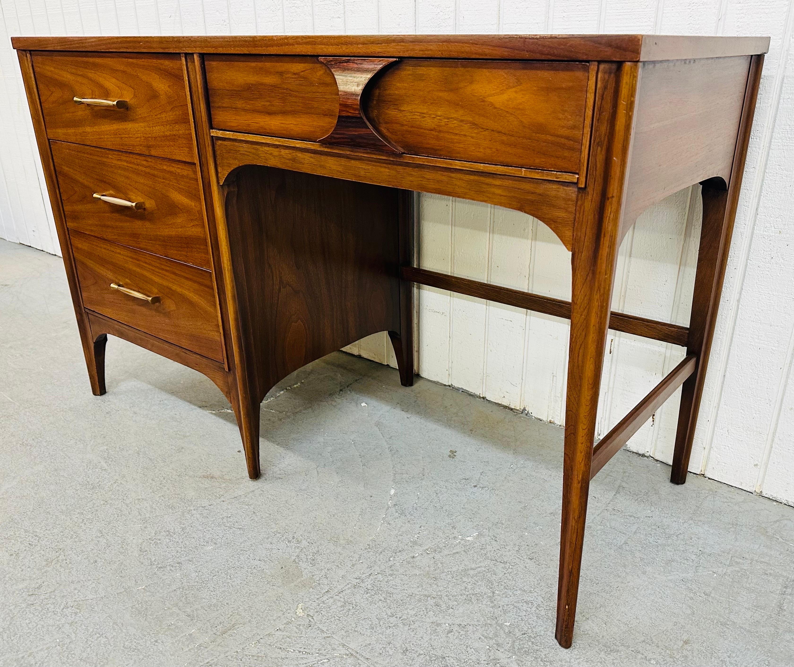 This listing is for a Mid-Century Modern Kent Coffey Perspecta Walnut Desk. Featuring a straight line design with a rectangular top, three drawers on the left with original hardware, a single drawer on the right with the iconic Perspecta rosewood