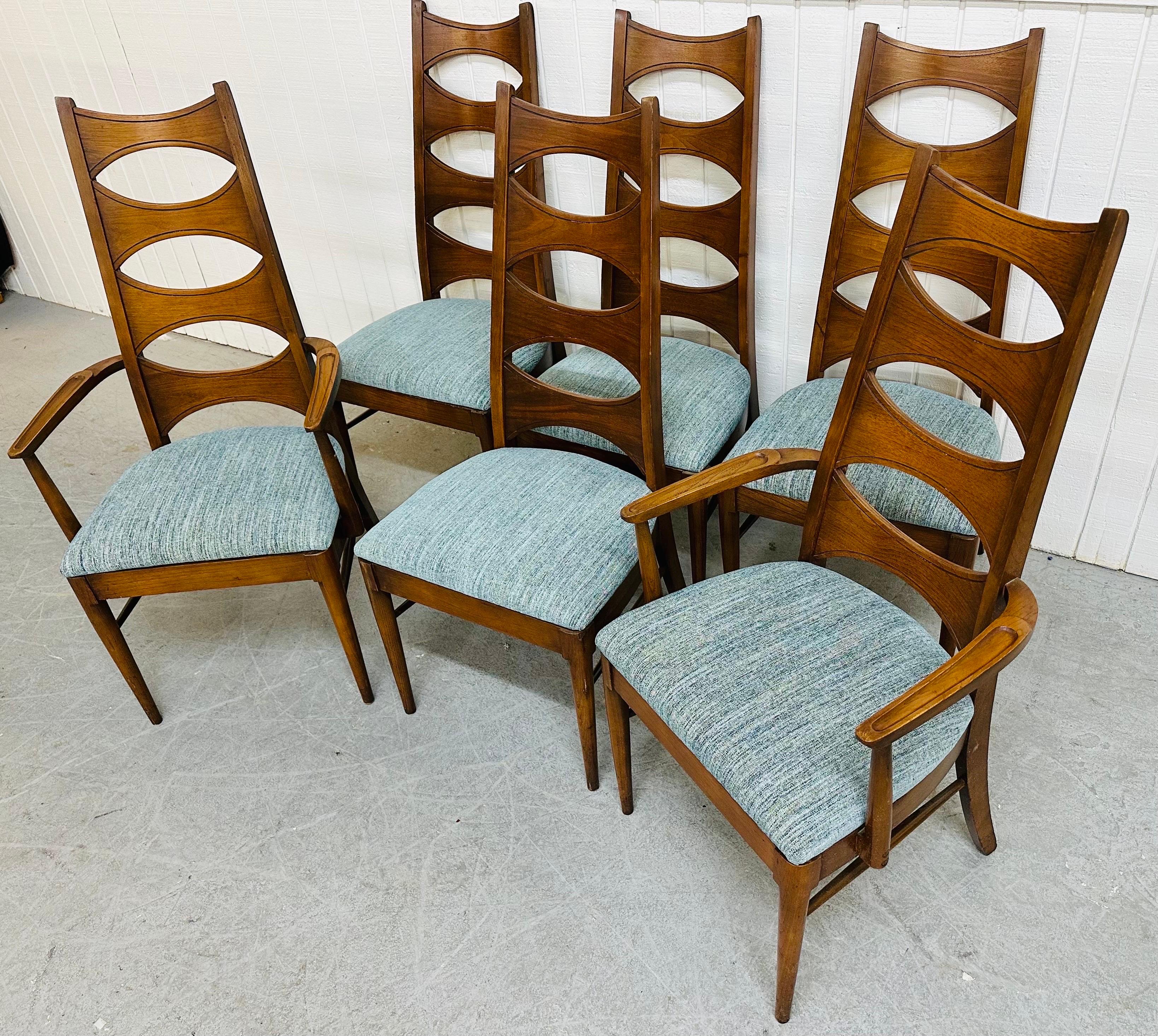 This listing is for a set of six Mid-Century Modern Kent Coffey Perspecta Walnut Dining Chairs. Featuring two arm chairs, four straight chairs, a high back cats eye design, newly upholstered seats, and a beautiful walnut finish. This is an