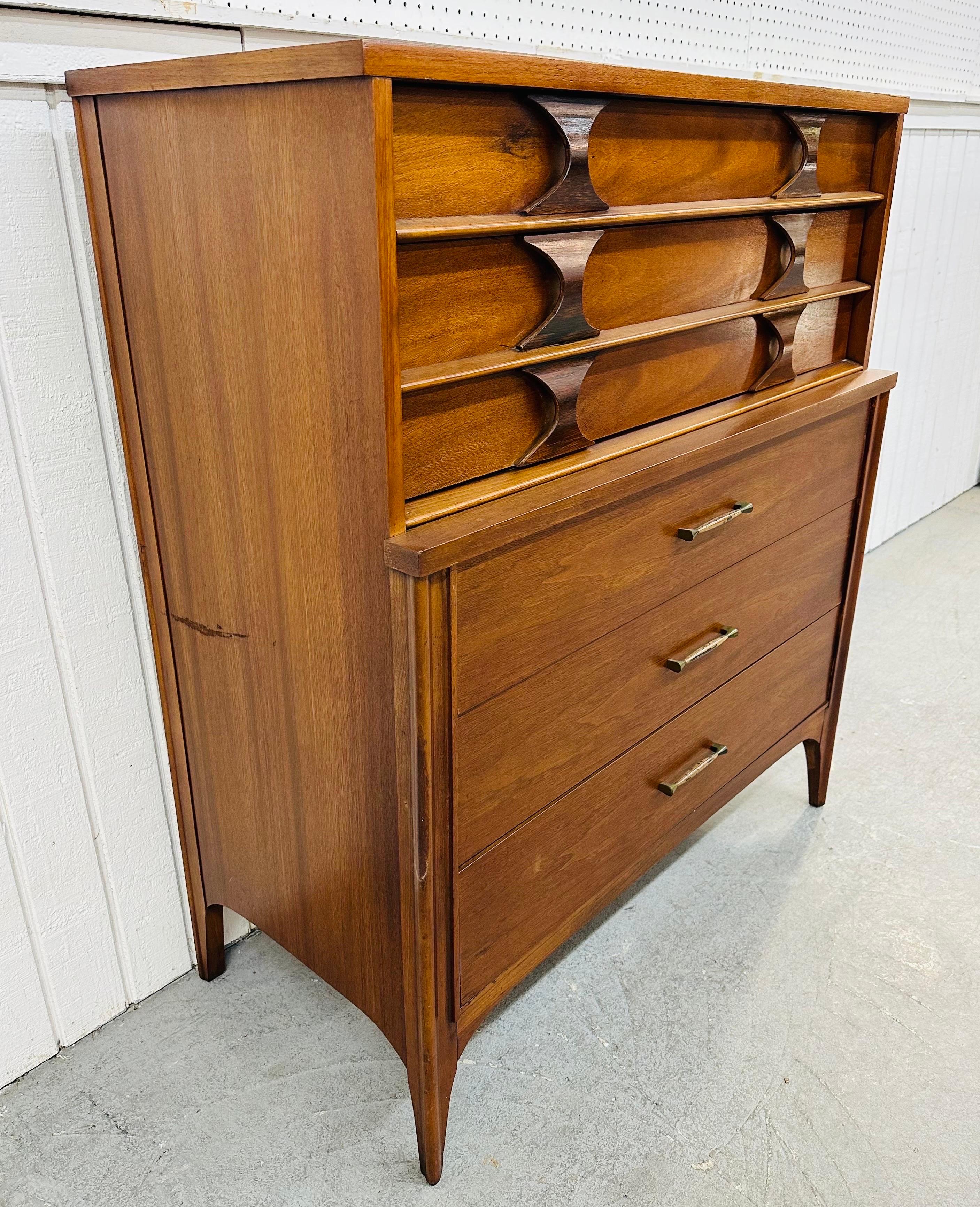 This listing is for a Mid-Century Modern Kent Coffey Perspecta Walnut High Chest. Featuring a straight line design, two drawers at the top with rosewood sculpted pulls, three drawers at the bottom with original hardware, modern legs, and a beautiful