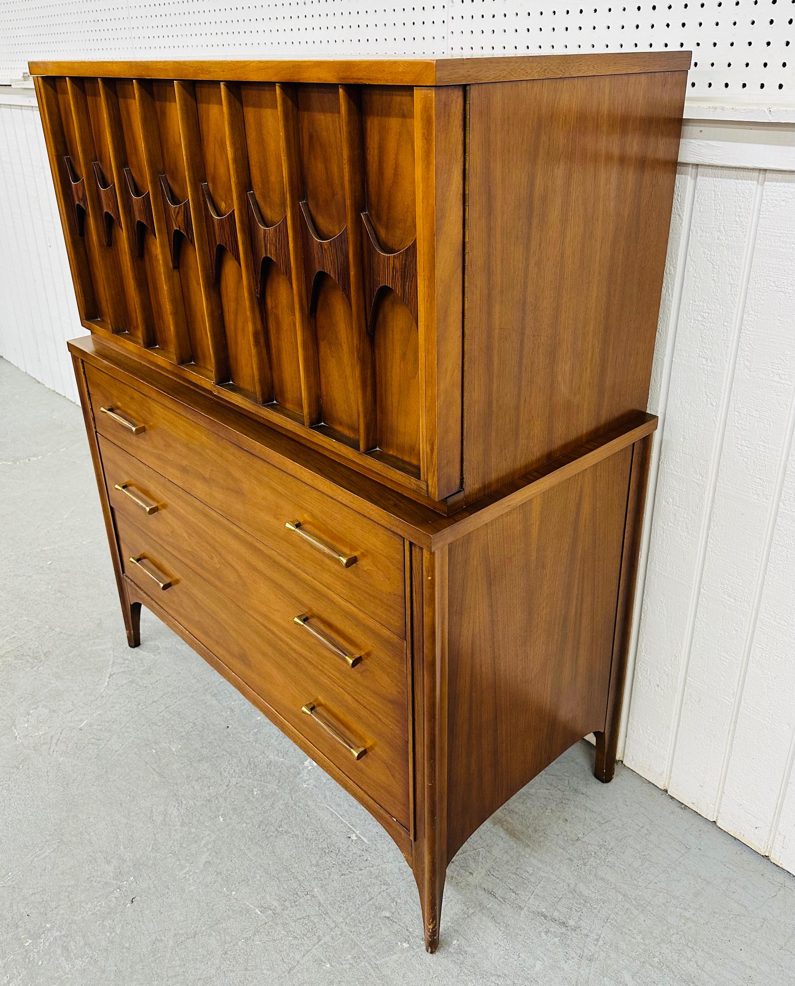 This listing is for a Mid-Century Modern Kent Coffey Perspecta Walnut High Chest. Featuring a straight line design, two doors with sculpted rosewood pulls that open up to storage space, three large drawers at the bottom with original hardware,