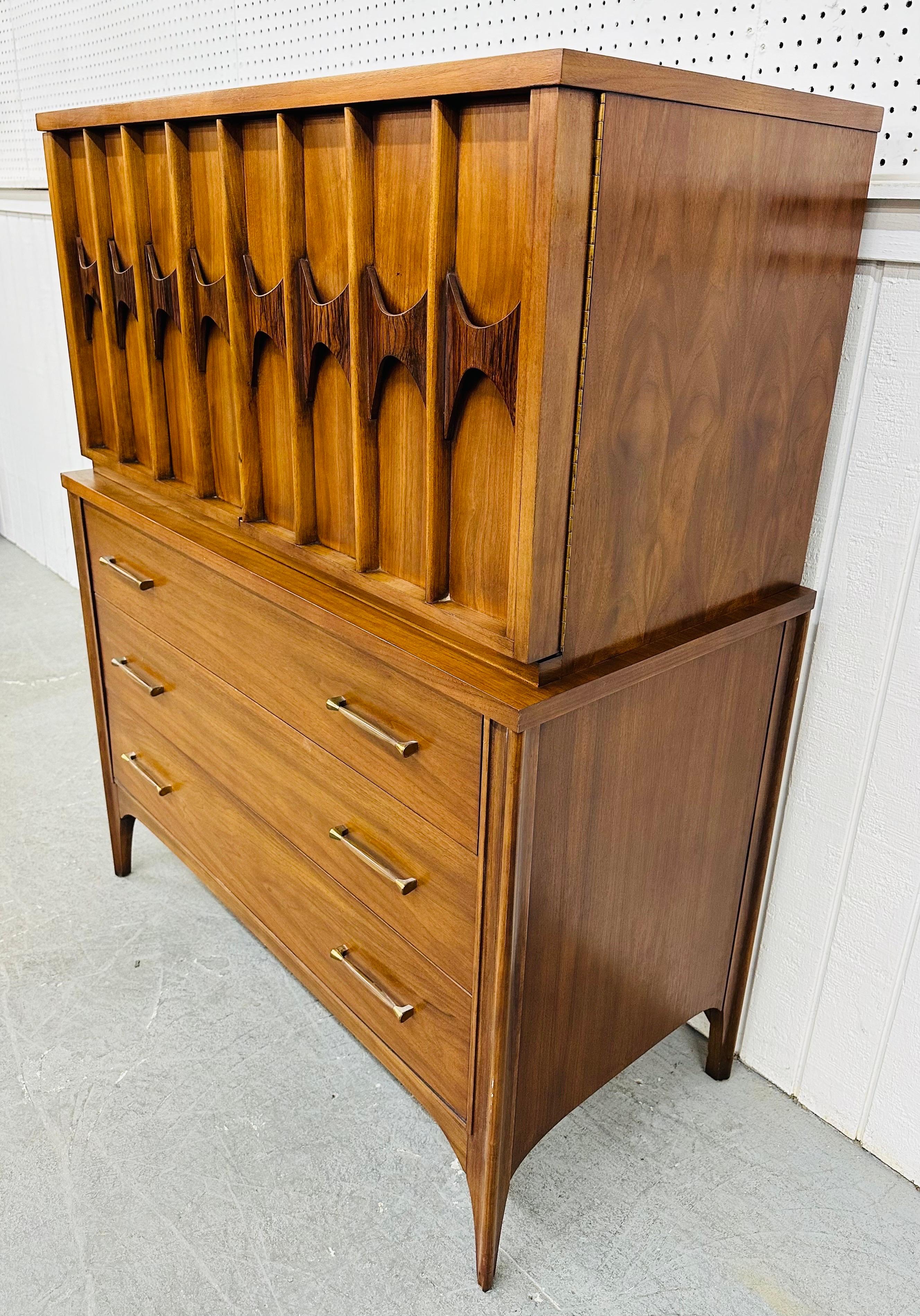 This listing is for a Mid-Century Modern Kent Coffey Perspecta Walnut High Chest. Featuring a straight line design, two doors with sculpted rosewood pulls that open up to storage space, three large drawers at the bottom with original hardware,