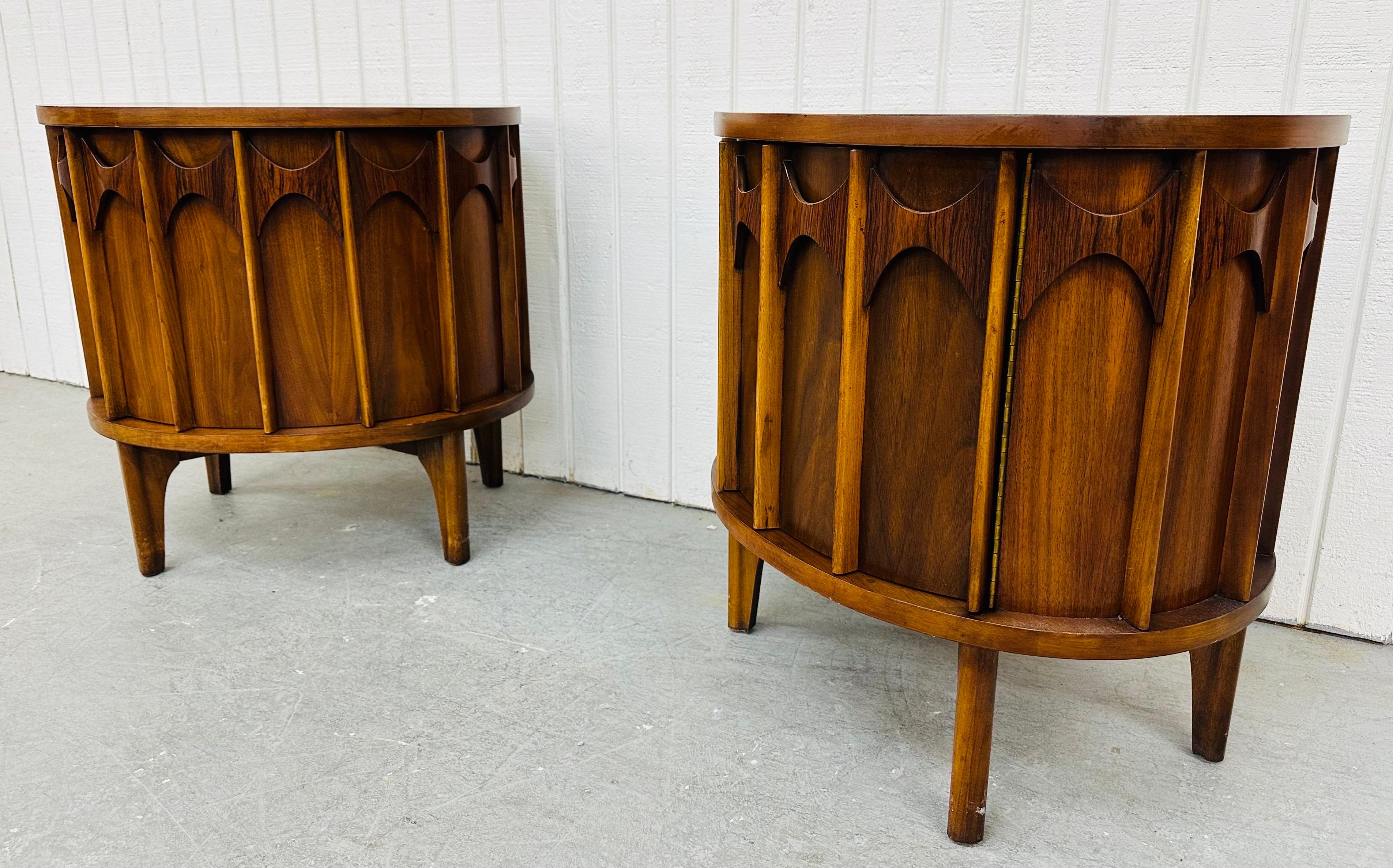 This listing is for a pair of Mid-Century Modern Kent Coffey Perspecta Walnut Nightstands. Featuring a rounded design, single door that opens up to storage space, a single drawer, sculpted rosewood across the top, modern legs, and a beautiful walnut