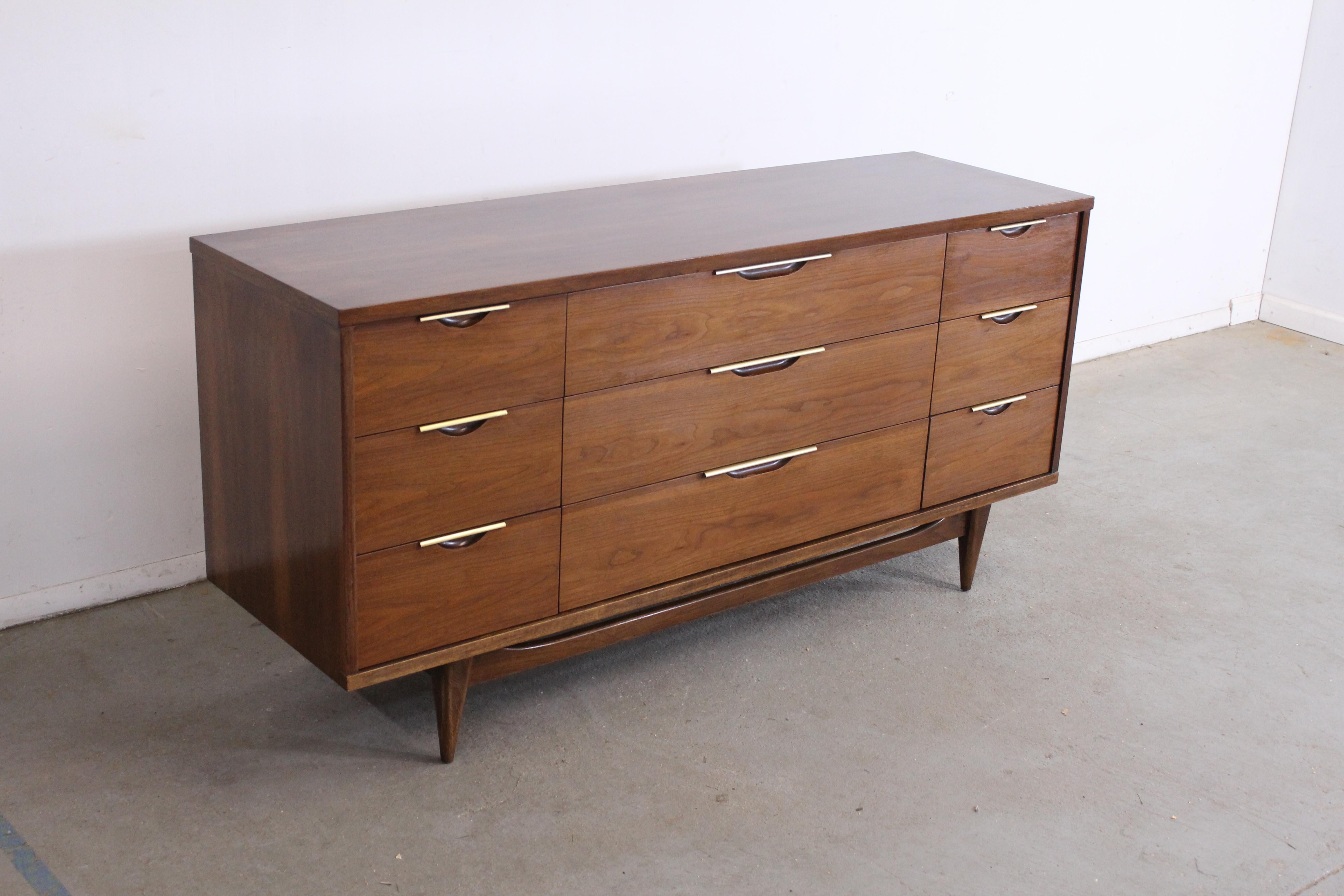 Mid-Century Modern Kent Coffey tableau credenza on stretcher base.

Offered is a Mid-Century Modern Kent Coffey tableau credenza on stretcher base. It features 9 drawers. It has an spectacular stretcher base. In very good condition and