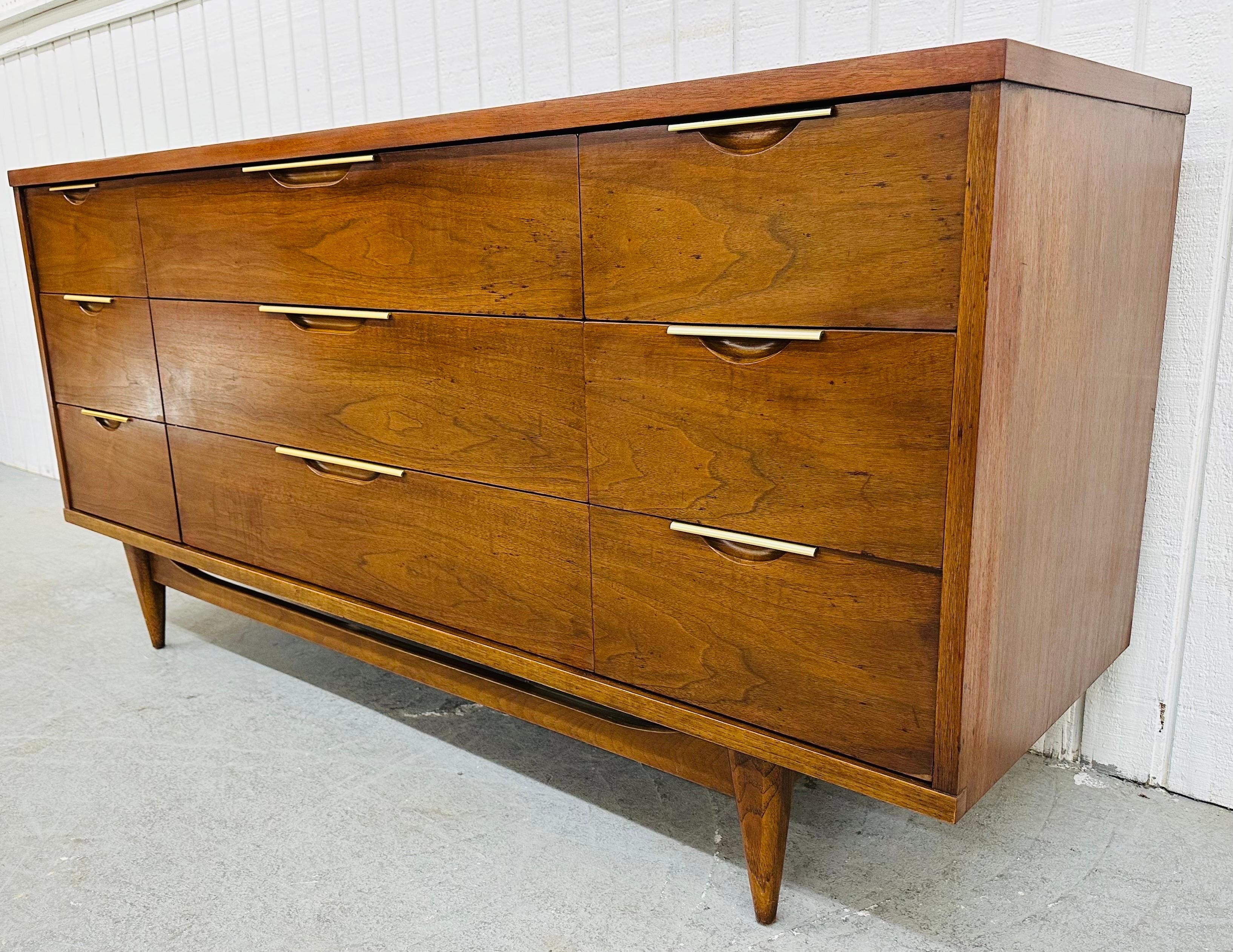 This listing is for a Mid-Century Modern Kent Coffey Tableau Walnut Dresser. Featuring a straight line design, nine drawers for storage, original chrome pulls, and a beautiful walnut finish. This is an exceptional combination of quality and design