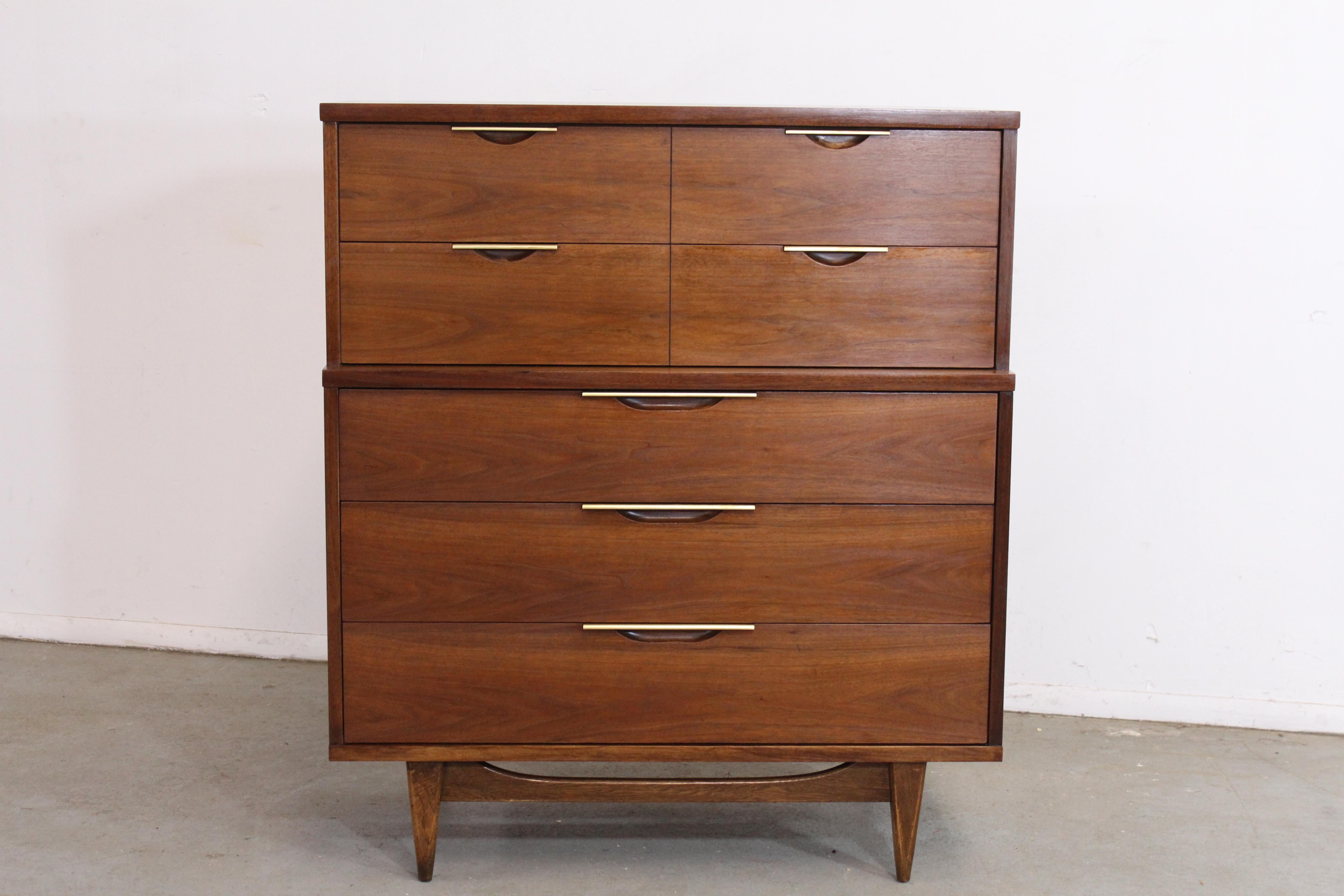 Mid-Century Modern Kent Coffey tableau walnut tall chest on stretcher base.

Offered is a beautiful Mid-Century Modern Kent Coffey tableau walnut tall chest on stretcher base. It has an spectacular stretcher base. In very good condition and
