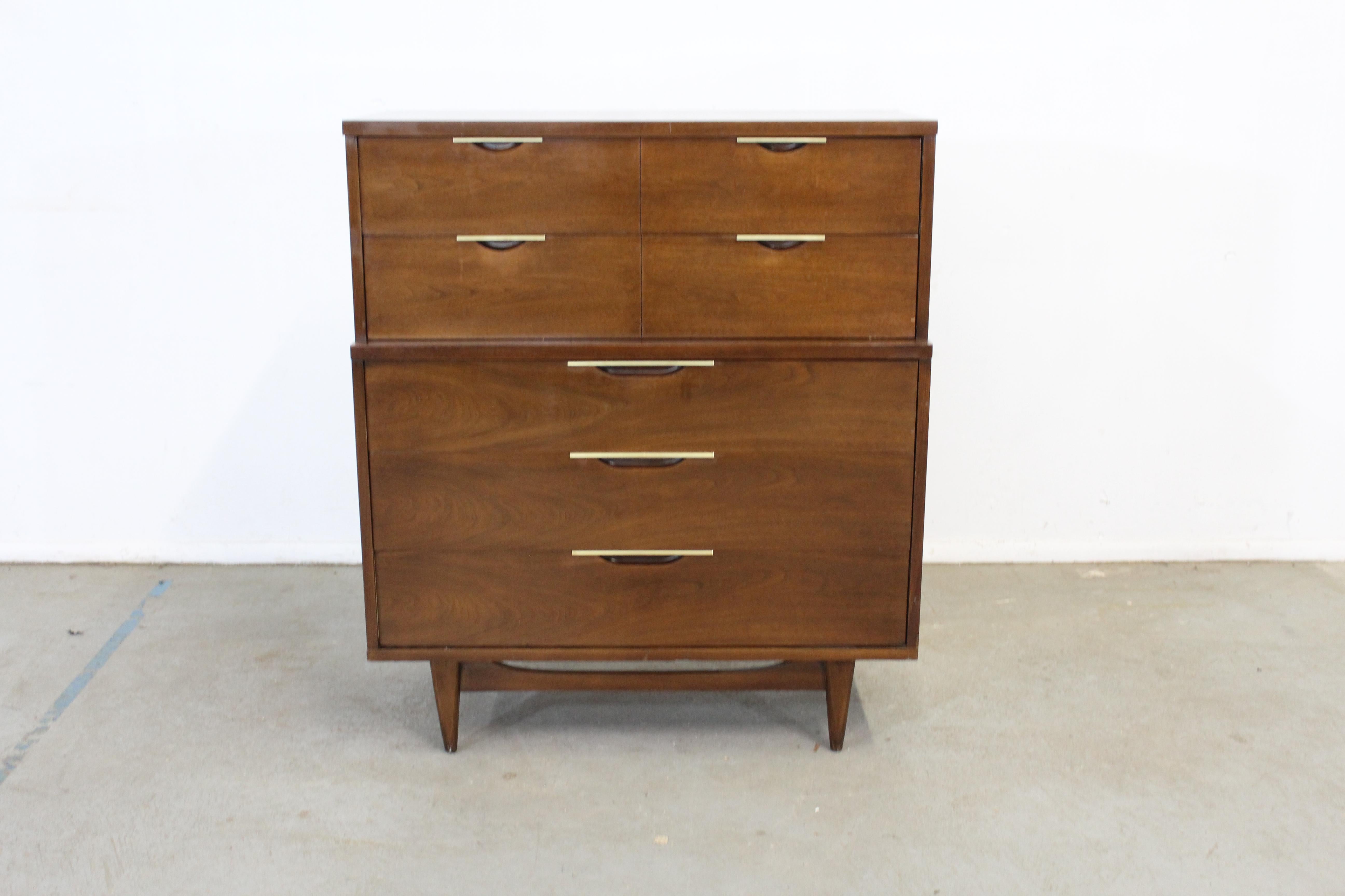 Mid-Century Modern Kent Coffey tableau walnut tall chest on stretcher base

Offered is a beautiful Mid-Century Modern Kent Coffey tableau walnut tall chest on stretcher base. It has an spectacular stretcher base. This model has a laminate faux