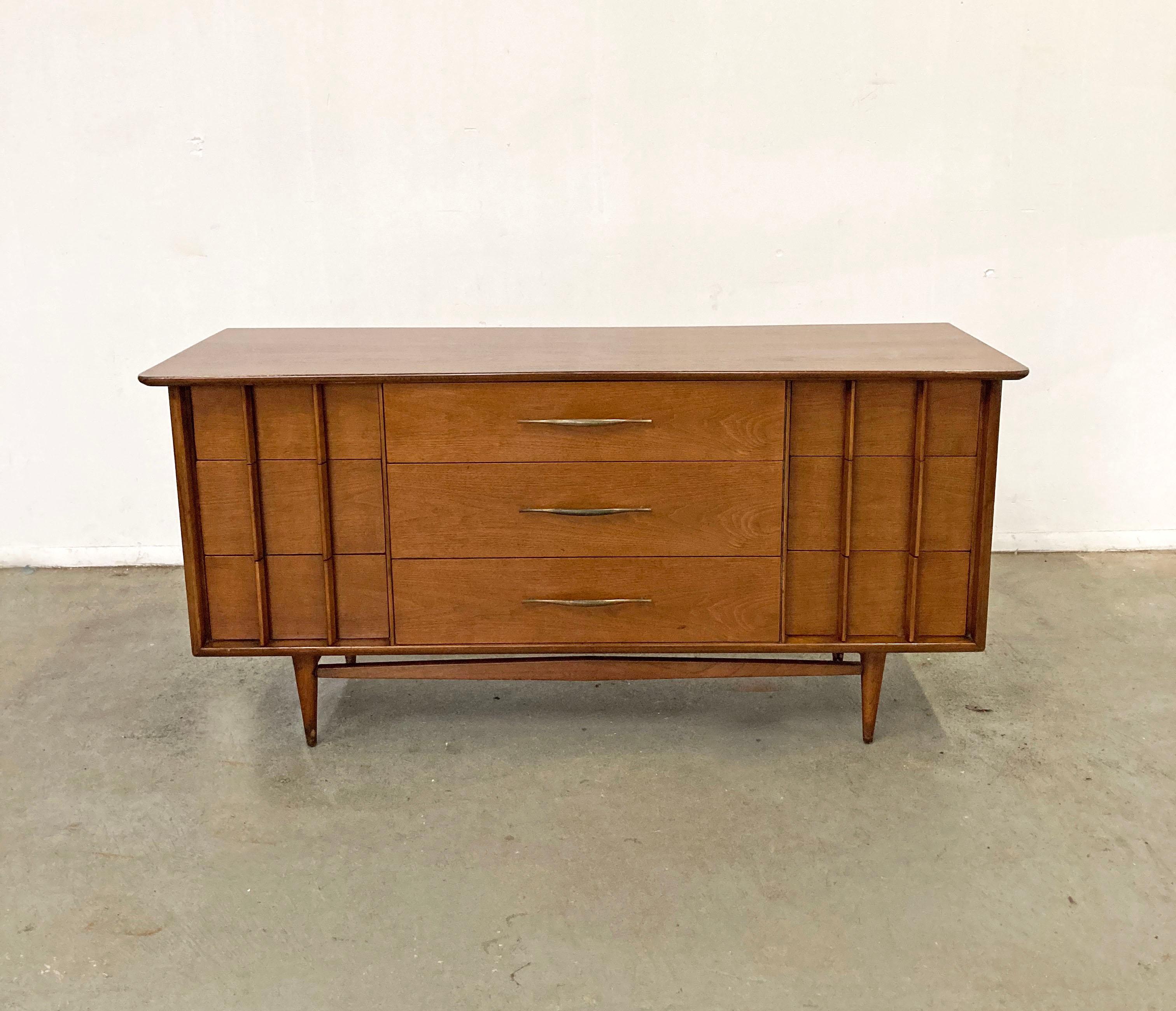 Offered is a vintage mid century modern credenza, made by Kent Coffey 