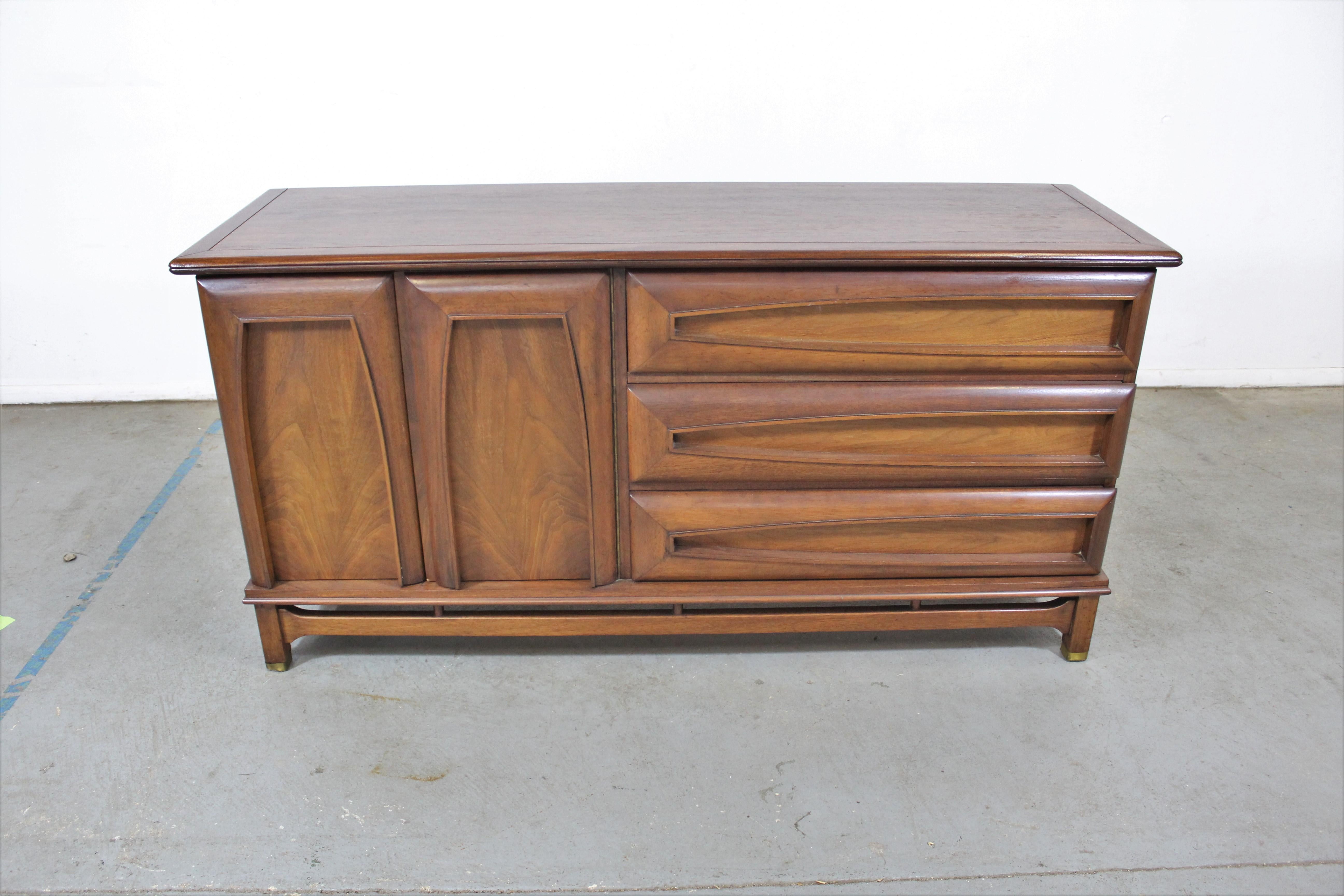 Offered is a vintage Mid-Century Modern credenza made by Kent Coffey 