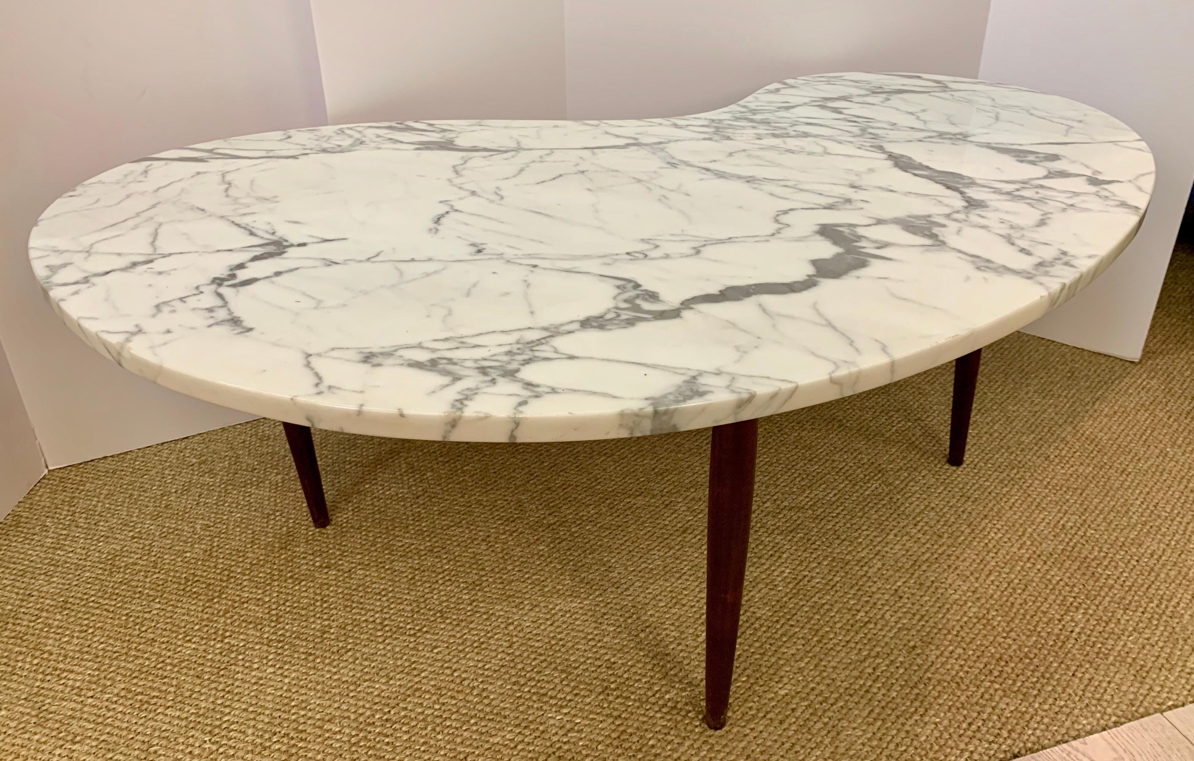 Iconic Danish Mid-Century Modern kidney shaped cocktail table with sculptural marble top.
