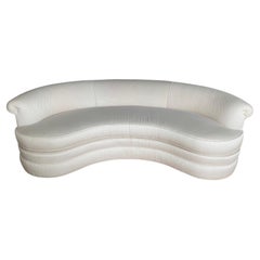 Divano a forma di rene a forma di serpentina biomorfa di metà secolo.