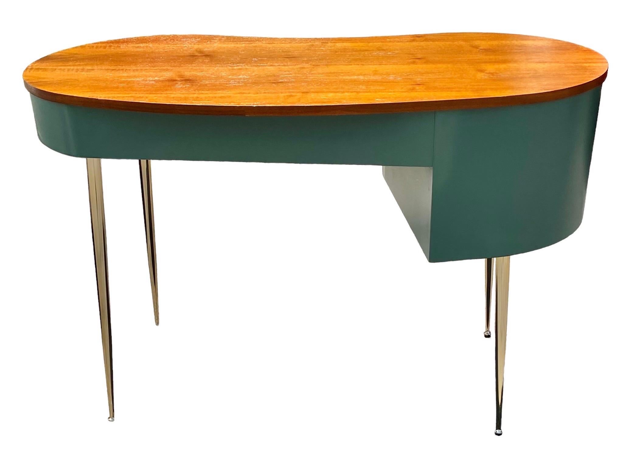 Featuring a mid-century modern design with golden accents, this exquisite office desk must be an eye-catching masterpiece in your room. The spacious desktop provides a large space for your books and decorations, while the open shelf and cabinet