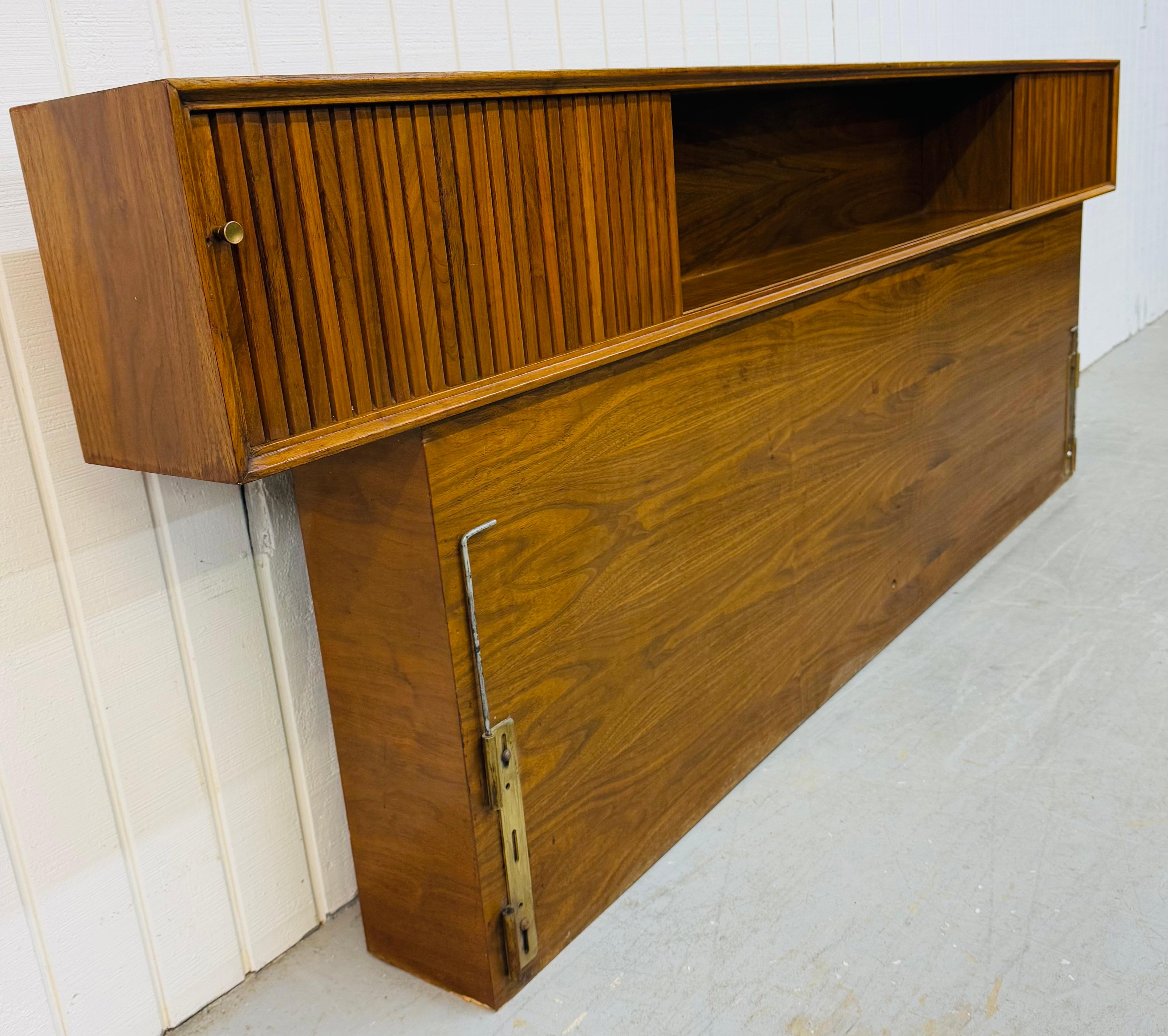 This listing is for a Mid-Century Modern King Size Tambour Walnut Headboard. Featuring a straight line design, sliding tambour doors that open to storage space, and a beautiful walnut finish. This is an exceptional combination of quality and MCM