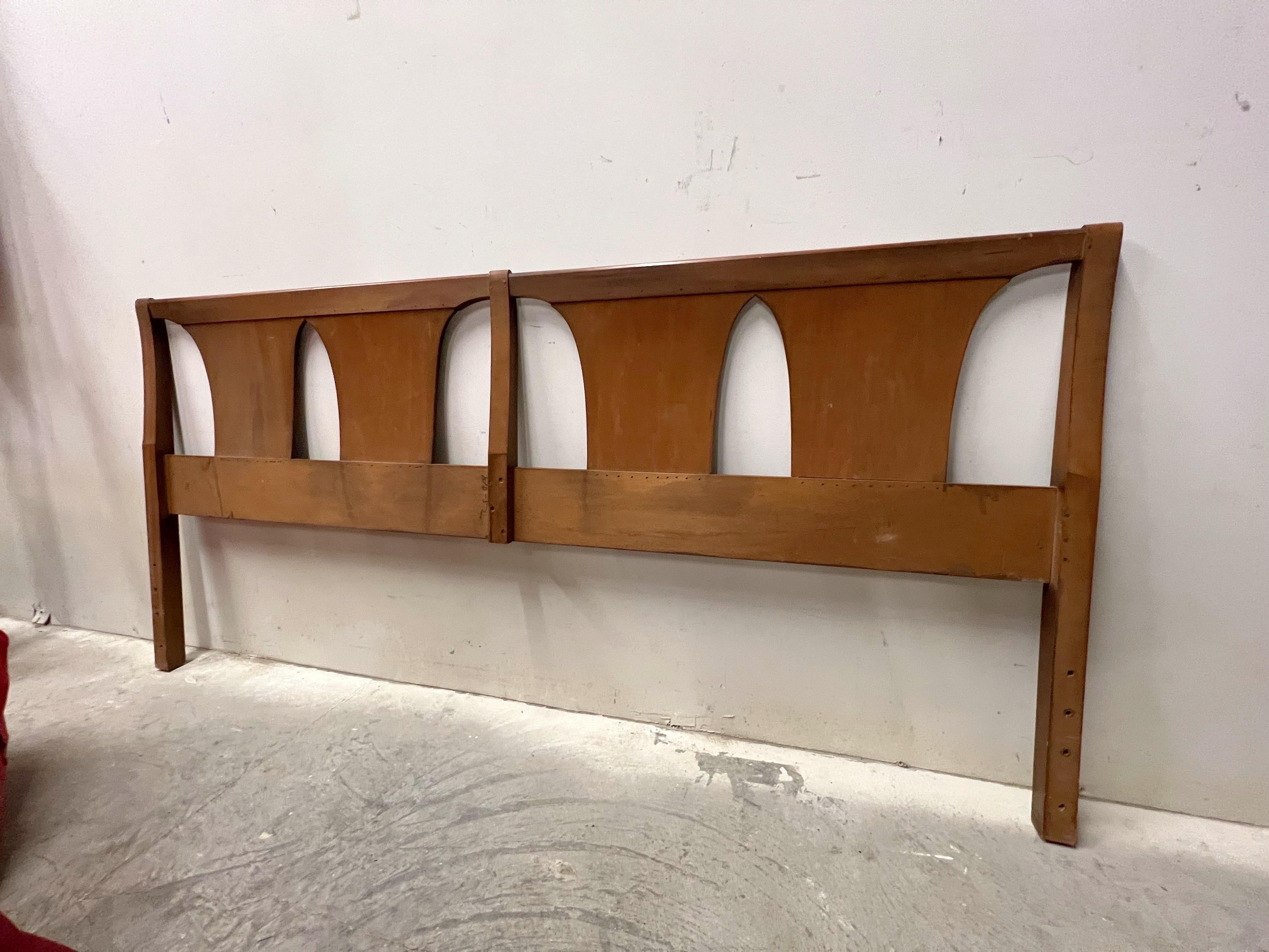 Here we have a richly grained walnut king size headboard with 4 inverted slats.  A fabulous modern shape and very much in the style of Kent Coffey.
