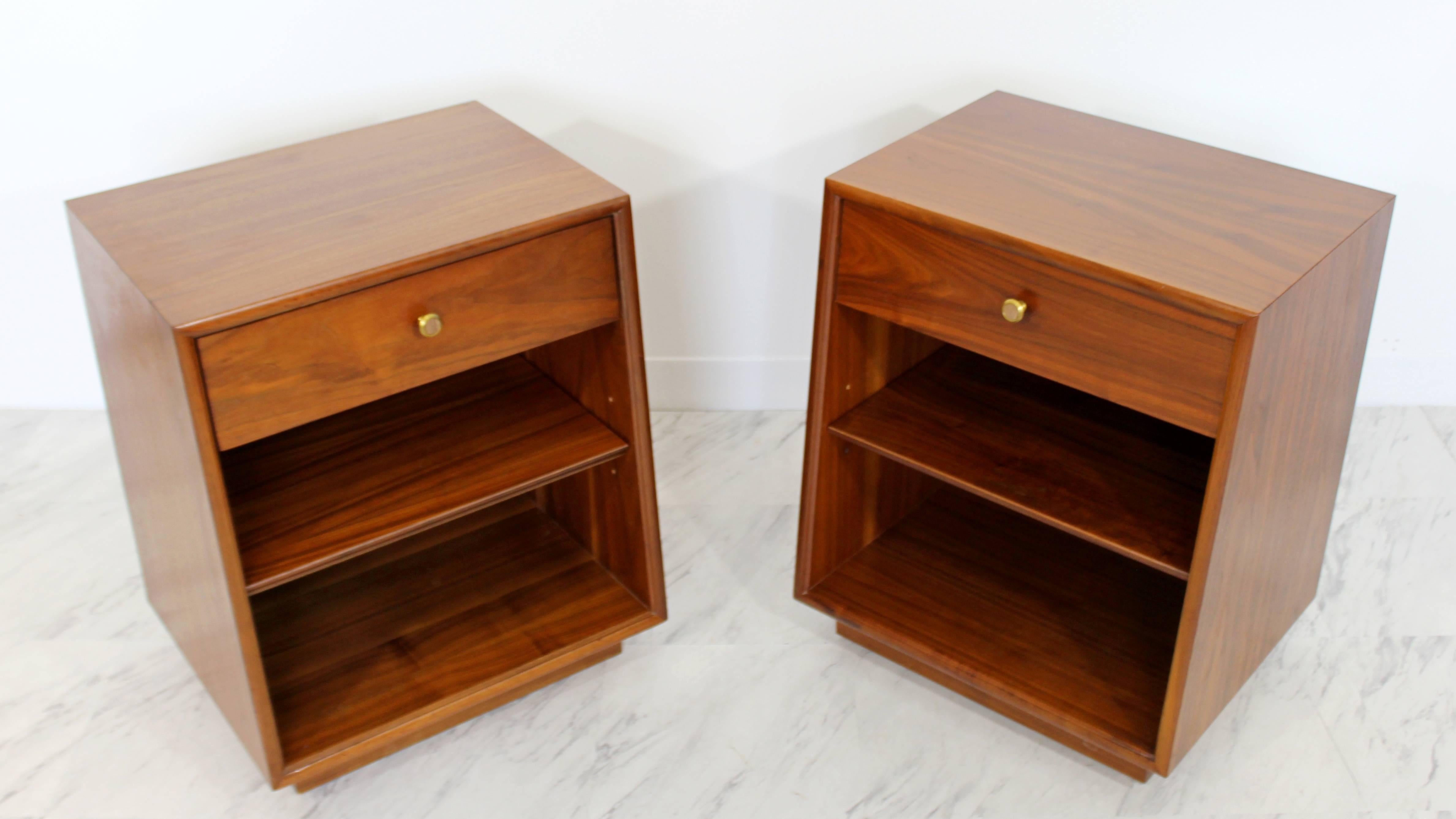For your consideration is a phenomenal pair of walnut nightstands, with one drawer each that have brass and wood knobs, by Kipp Stewart for Drexel, Declaration, circa 1960s. In excellent condition. The dimensions of each are 20