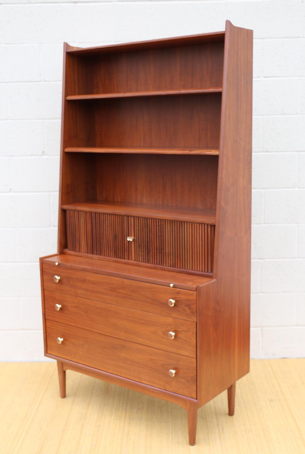 Wonderful vintage Mid Century Modern secretary desk designed by Drexel group, it is marked inside the drawer and in the back too. This iconic desk is made of walnut wood and brass handles, just a good quality desk. On the other hand, this amazing