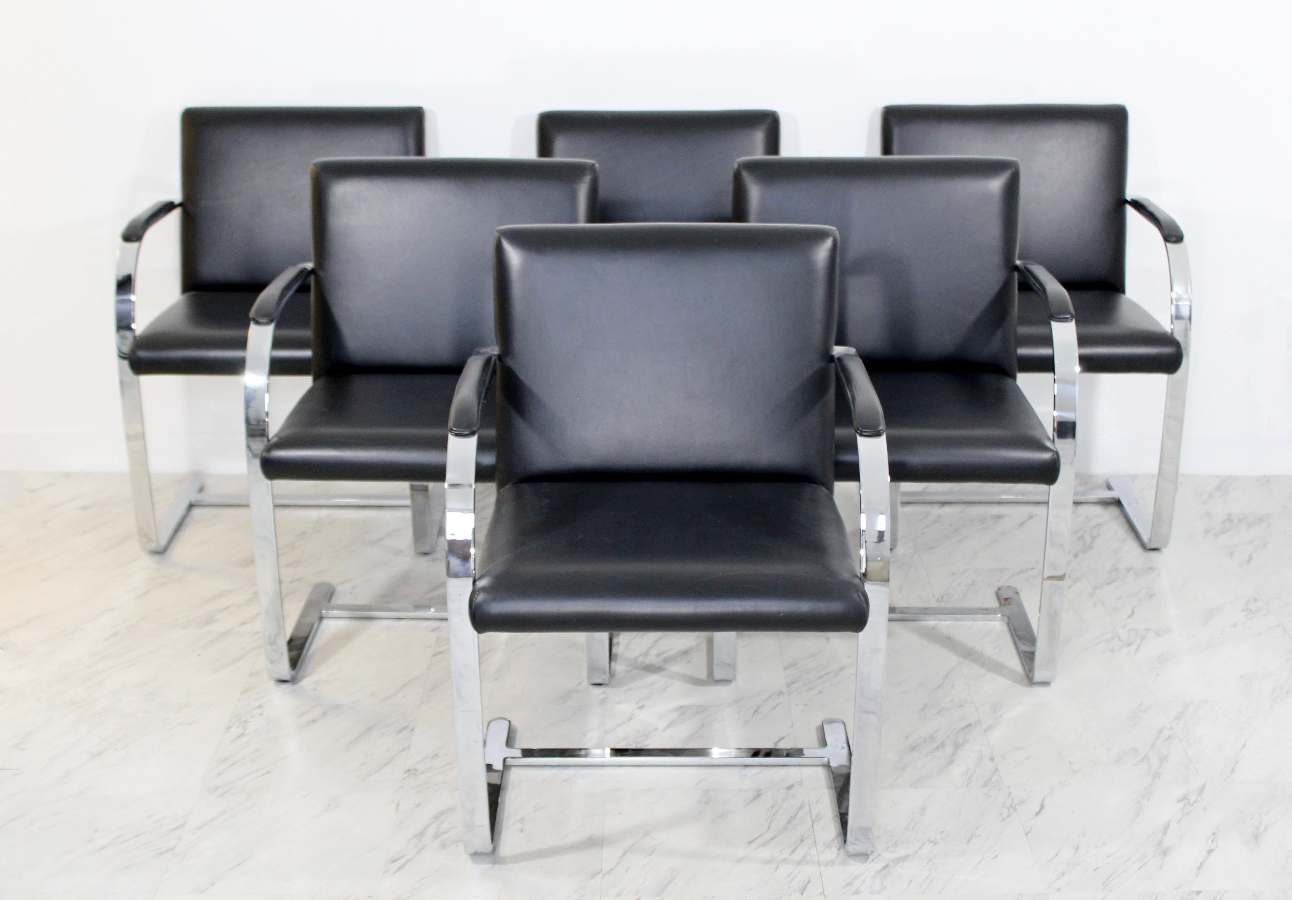 For your consideration is a gorgeous, set of six, chrome and black leather, cantilever, dining armchairs, by Knoll, circa 1970s. In excellent condition. The dimensions are 23