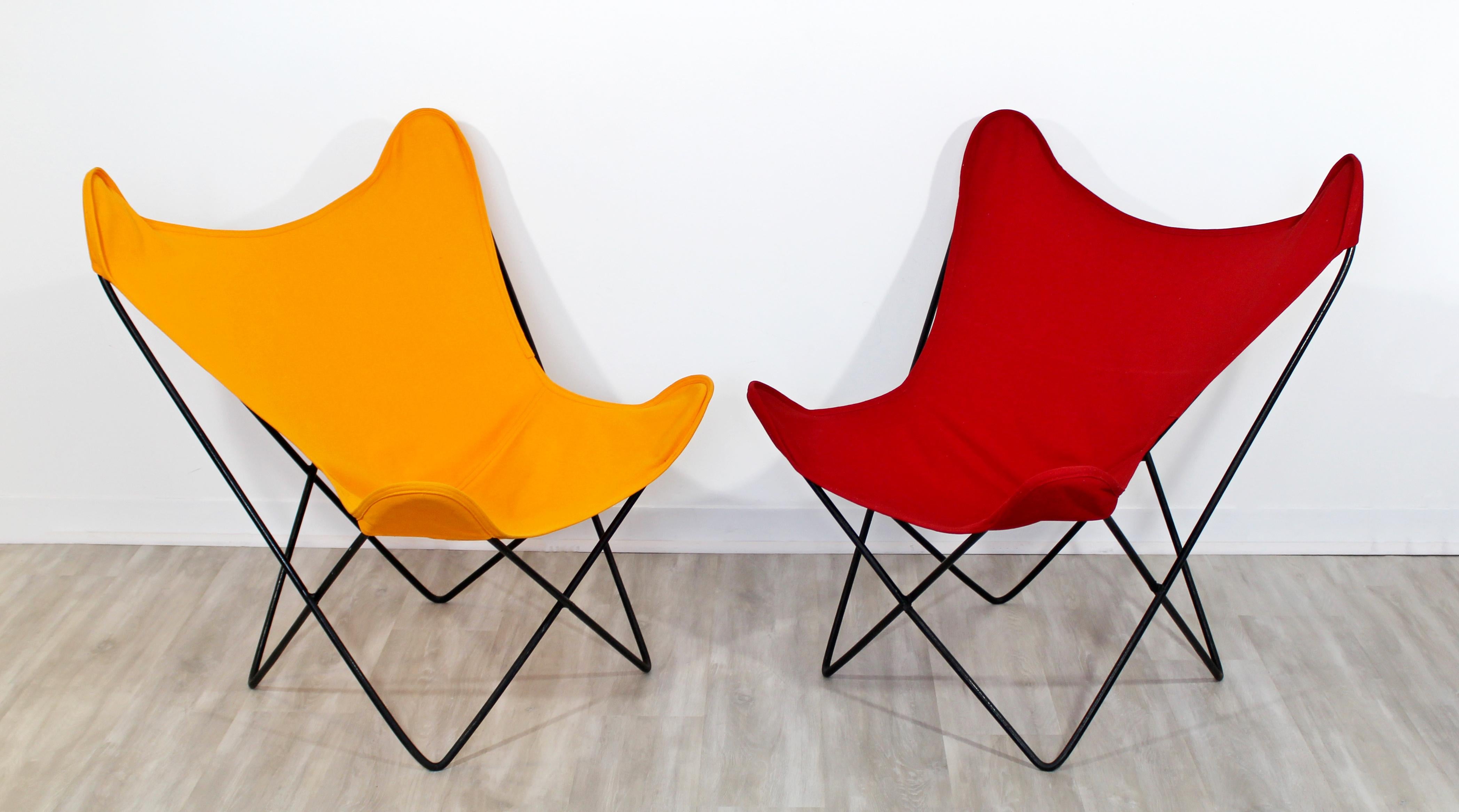For your consideration is a pair of iron butterfly lounge chairs, in red and orange, by Knoll, circa the 1970s. In excellent vintage condition. The dimensions are 31