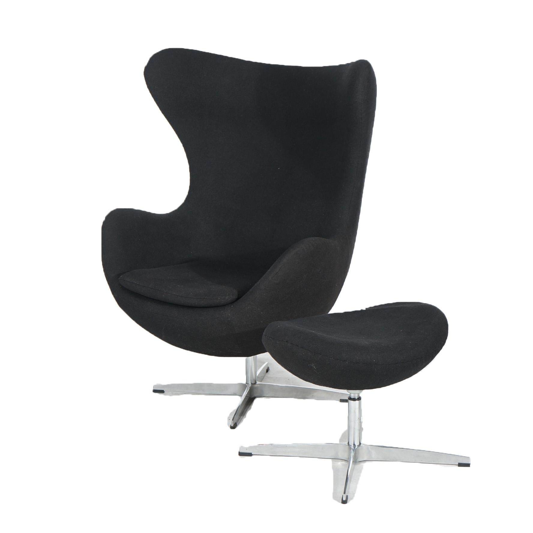 Mid-Century Modern Mid Century Modern Knoll School Black Swivel Womb Chair & Ottoman, 20th C For Sale
