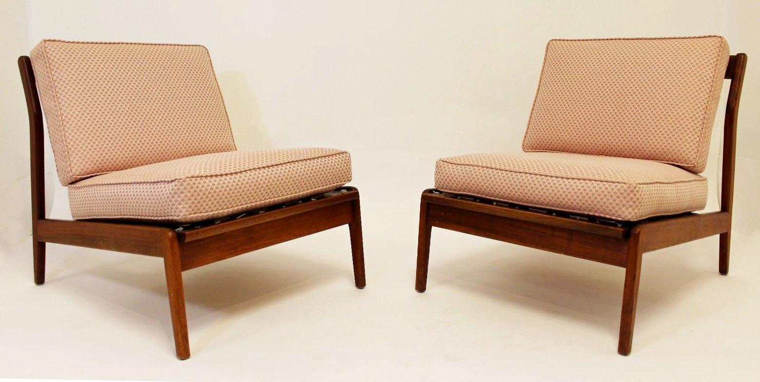For your consideration is a simple, yet stunning pair of lounge slipper chairs, with a pink upholstery, in the style of Kofod-Larsen. In excellent condition. The dimensions are 24