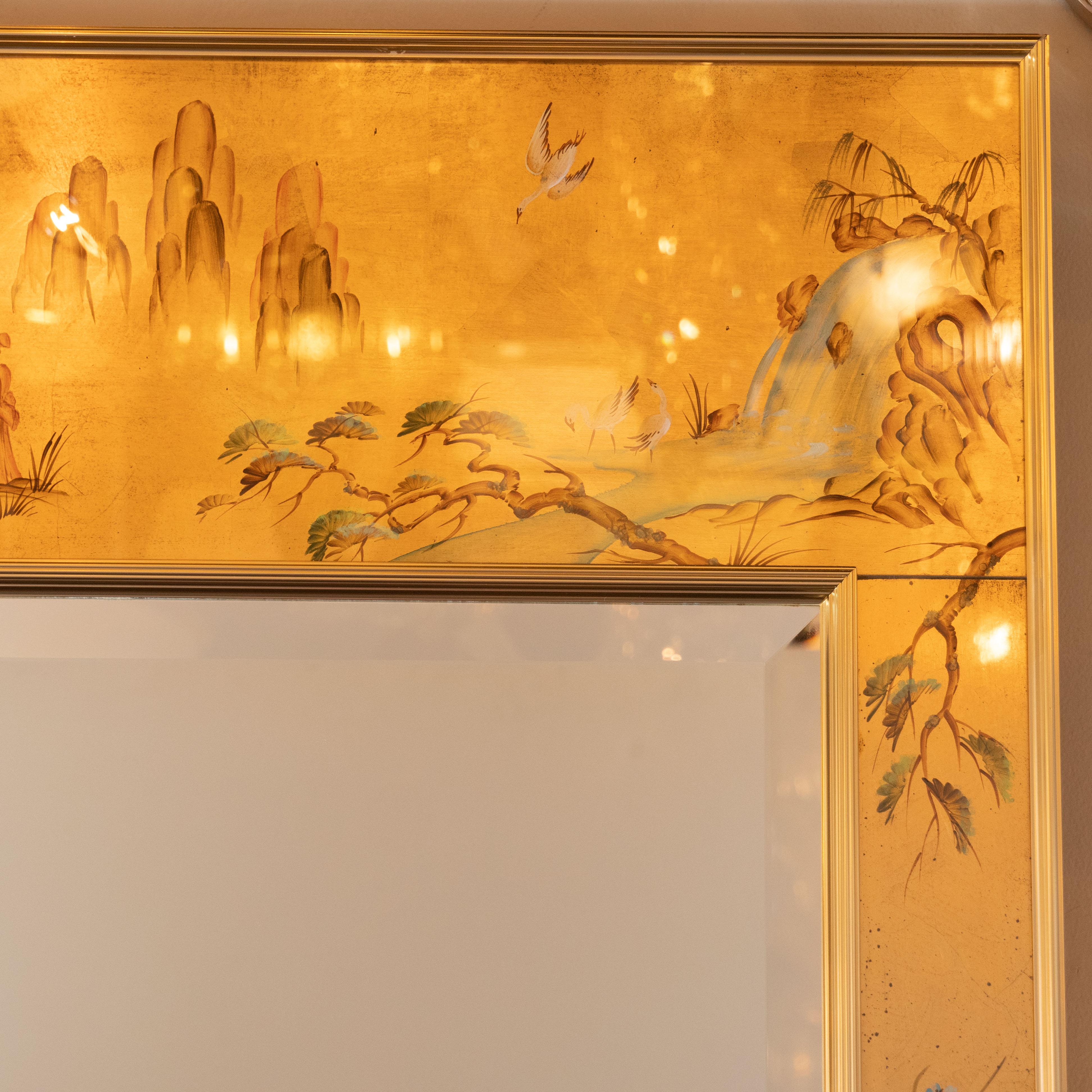 This exquisite chinoiserie reverse hand-painted glass, gilt and églomisé mirror was realized by the esteemed American producer, La Barge, circa 1980. The piece features two chromed and reeded rectangular frames with a gilded hand-painted chinoiserie