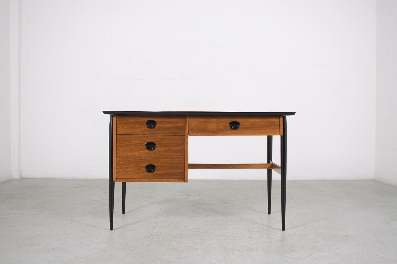 An extraordinary 1960s danish modern desk is hand-crafted out of walnut wood and is in great condition has been completely restored stripped and refinished by our professional expert craftsmen team making this piece ready to be displayed and used