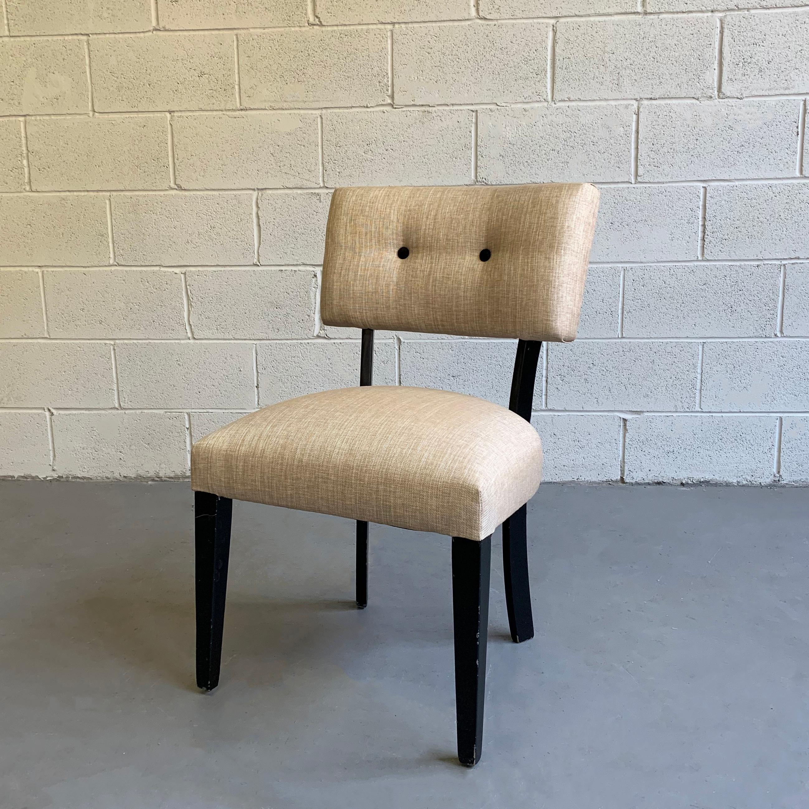 Mid-Century Modern, slipper side chair features a black lacquered maple frame with woven, cotton linen upholstery and contrasting covered buttons.