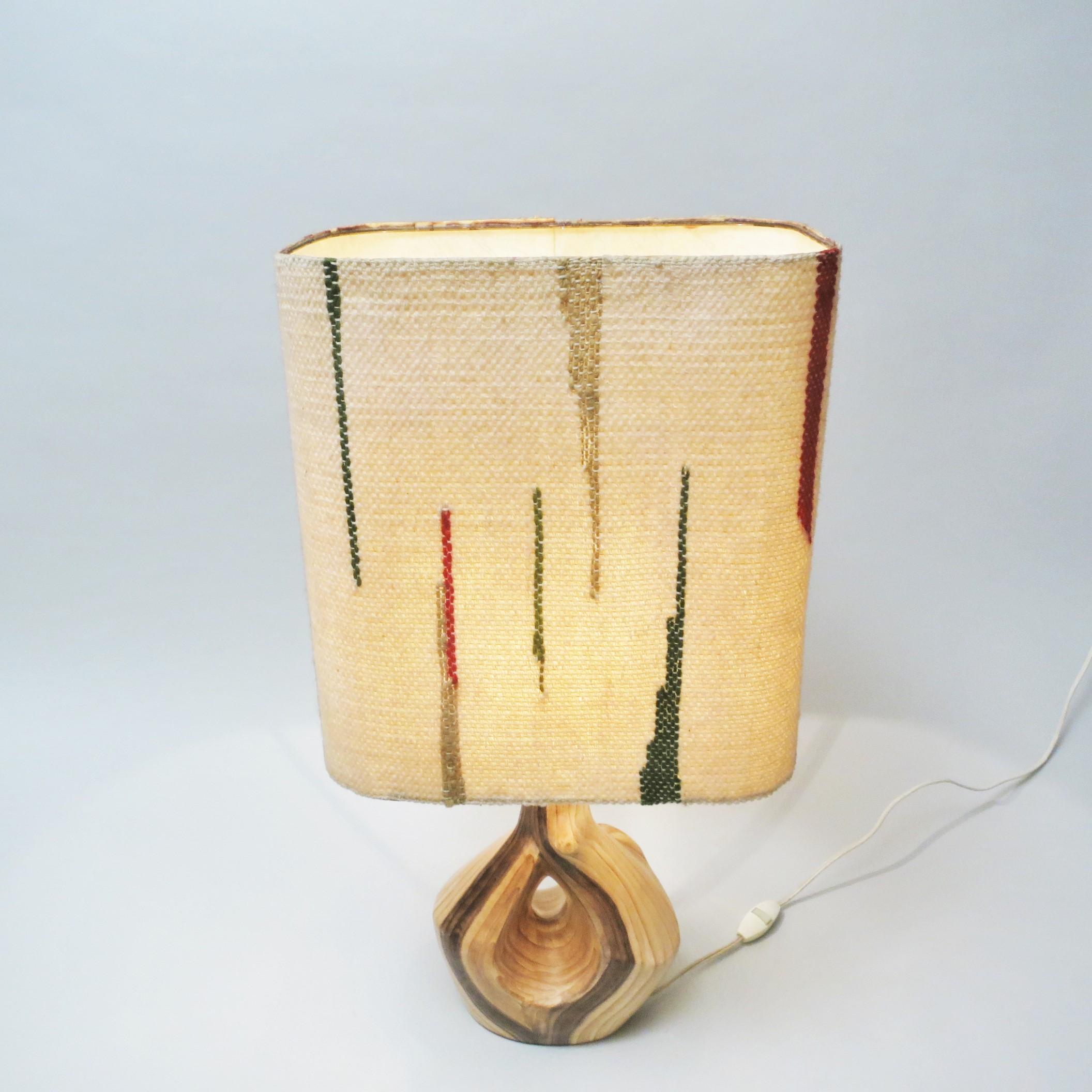 French Mid-Century Modern ceramic Lamp by Grandjean Jourdan. Ceramic with faux wood decor made in the 1950s in Vallauris on the French Riviera. Original shade in handcrafted tapestry with abstract pattern.
