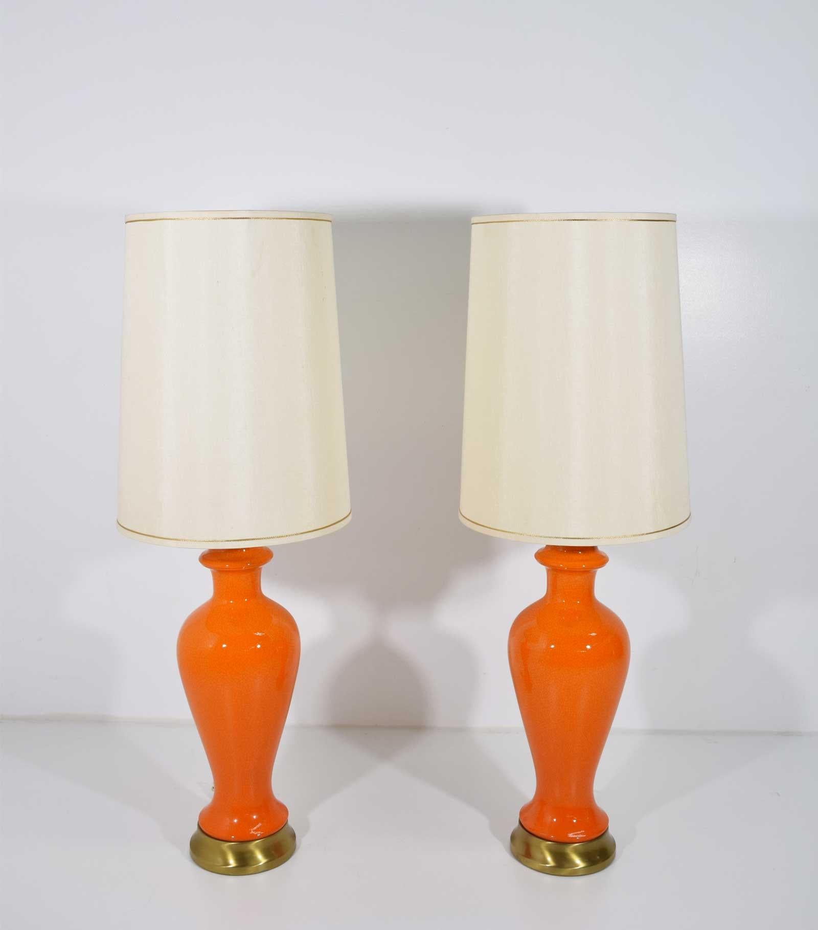 A very nice pair of Mid-Century Modern table lamps is a crackled ceramic. Bright orange. Pretty shades that look to be silk. Dimensions are to top of harp and diameter is the shade.