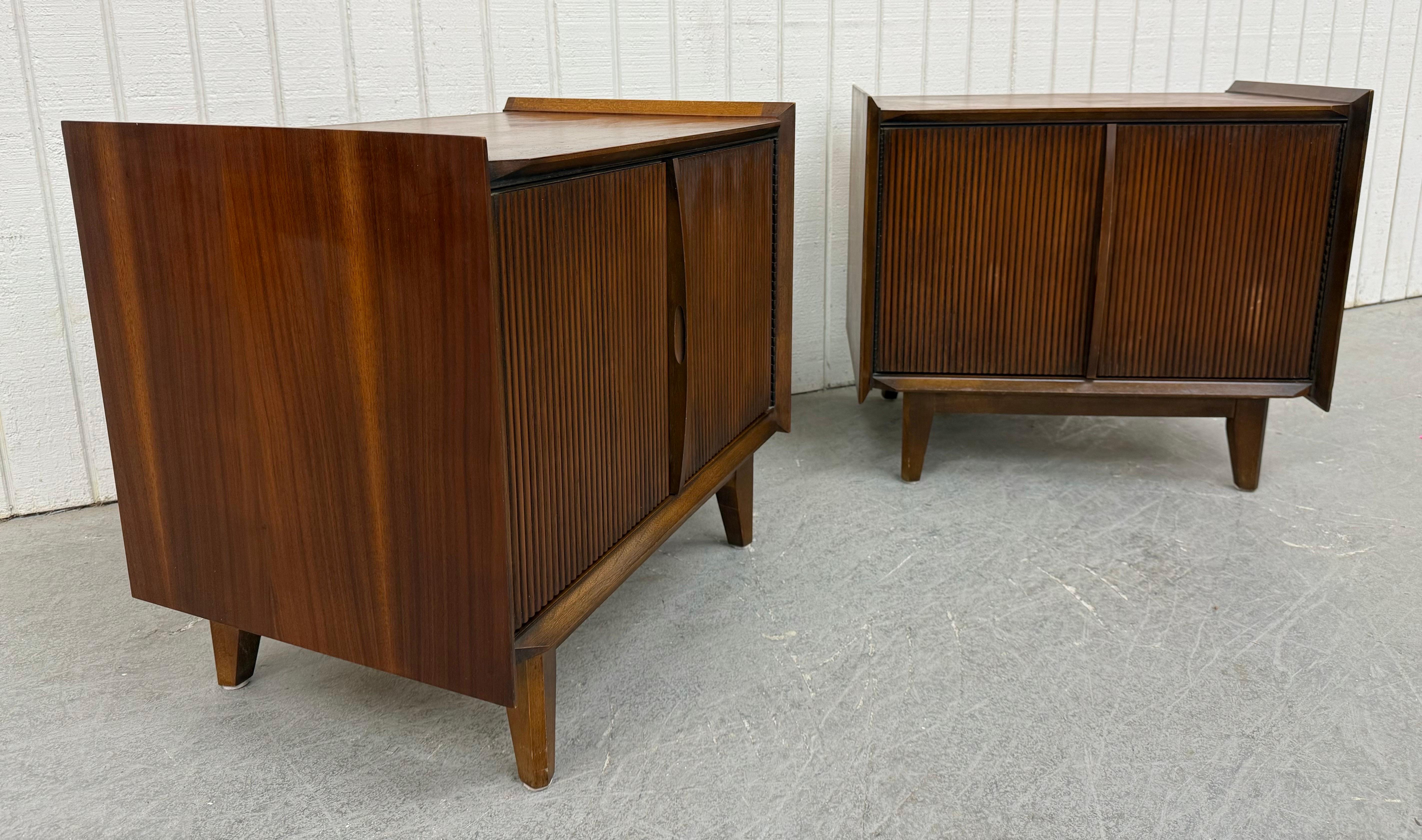 This listing is for a pair of Mid-Century Modern Lane 1st Edition Walnut Nightstands. Featuring a straight line design, two cabinet doors that open up to storage space, modern legs, and a beautiful dark walnut finish. This is an exceptional