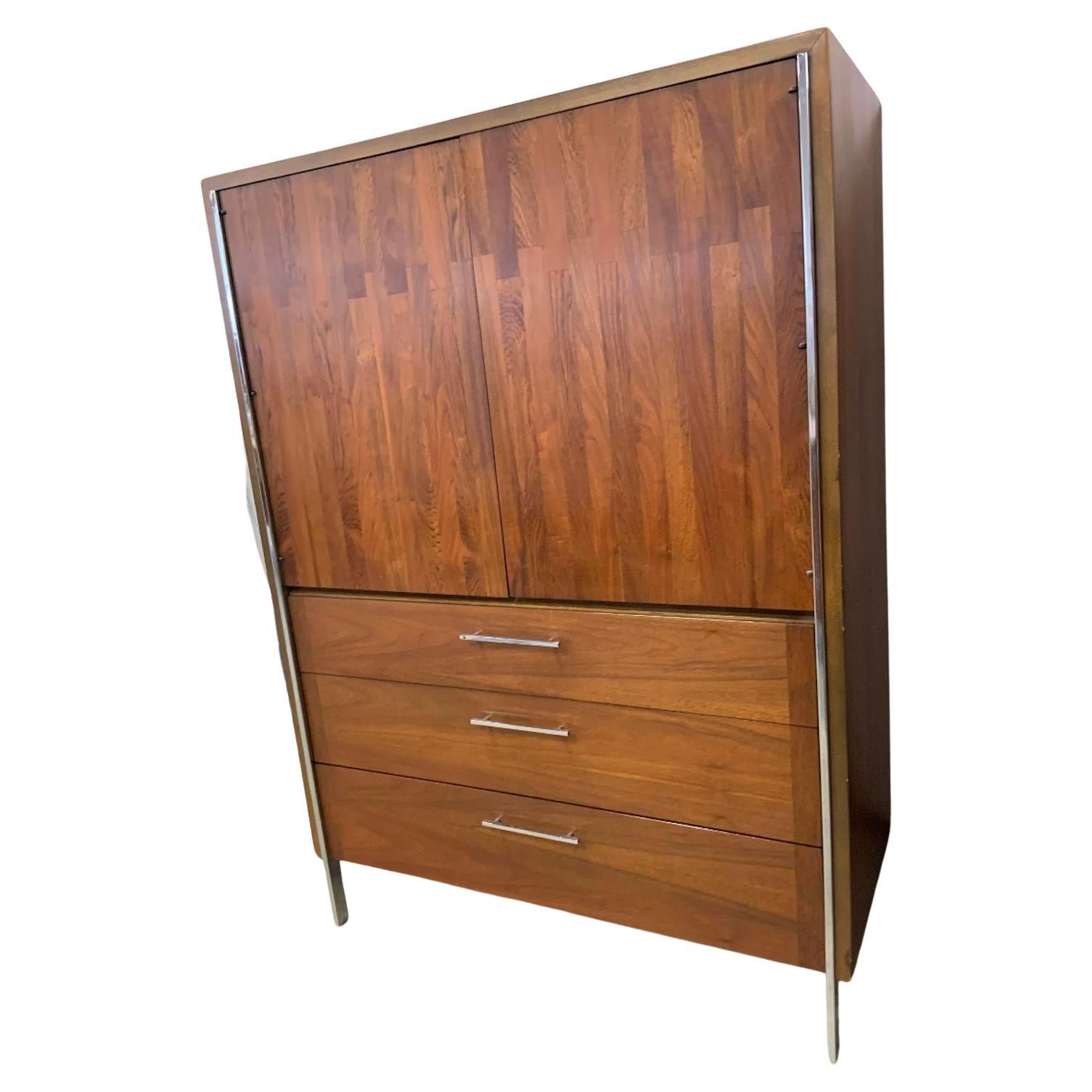Rare Mid-Century Modern Lane patchwork walnut and rosewood Wardrobe dresser Armoire circa 1970s well built. Has 2 center front cabinet doors with 2 Interior drawers behind them. Has exterior 3 lower drawers with lots of storage. Sits on flat bar