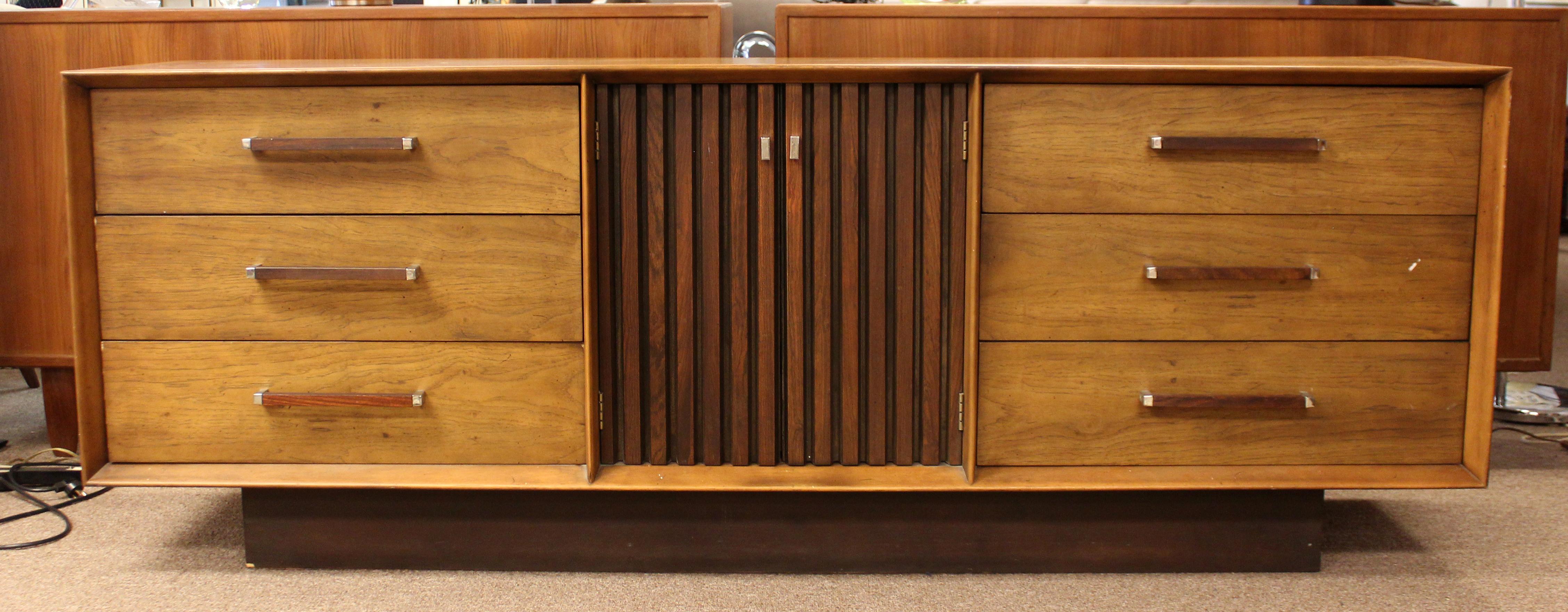 For your consideration is an incredible, ribbed pecan and rosewood bedroom set, including a nine drawer dresser, a four drawer highboy, a pair of tall mirrors,and a headboard, by Lane Altavista, circa 1971. In very good vintage condition. The
