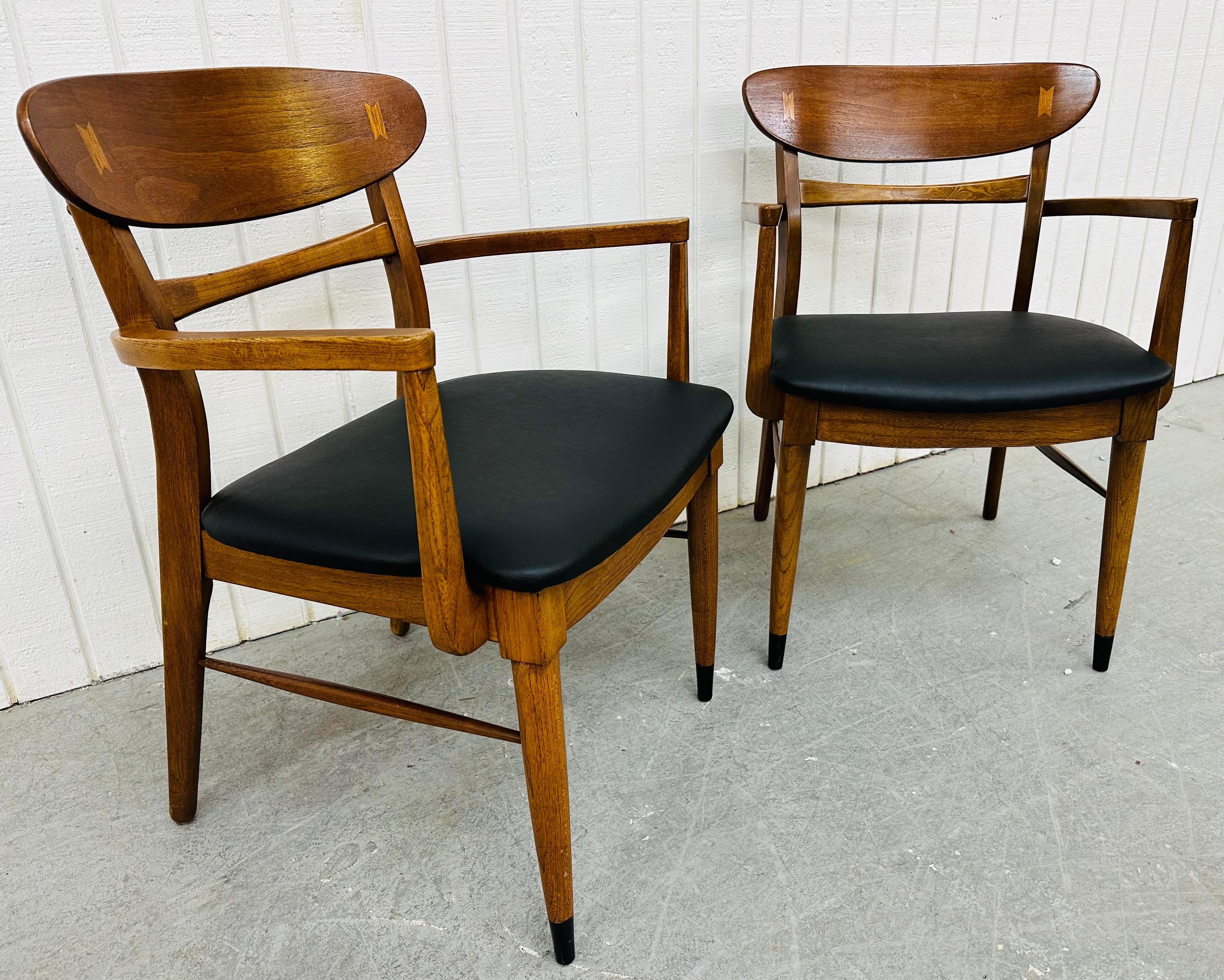 This listing is for a pair of Mid-Century Modern Lane Acclaim Walnut Arm Chairs. Featuring two arm chairs, oval walnut back rests, newly upholstered black vinyl seats, modern legs, and a beautiful walnut finish. This is an exceptional combination of