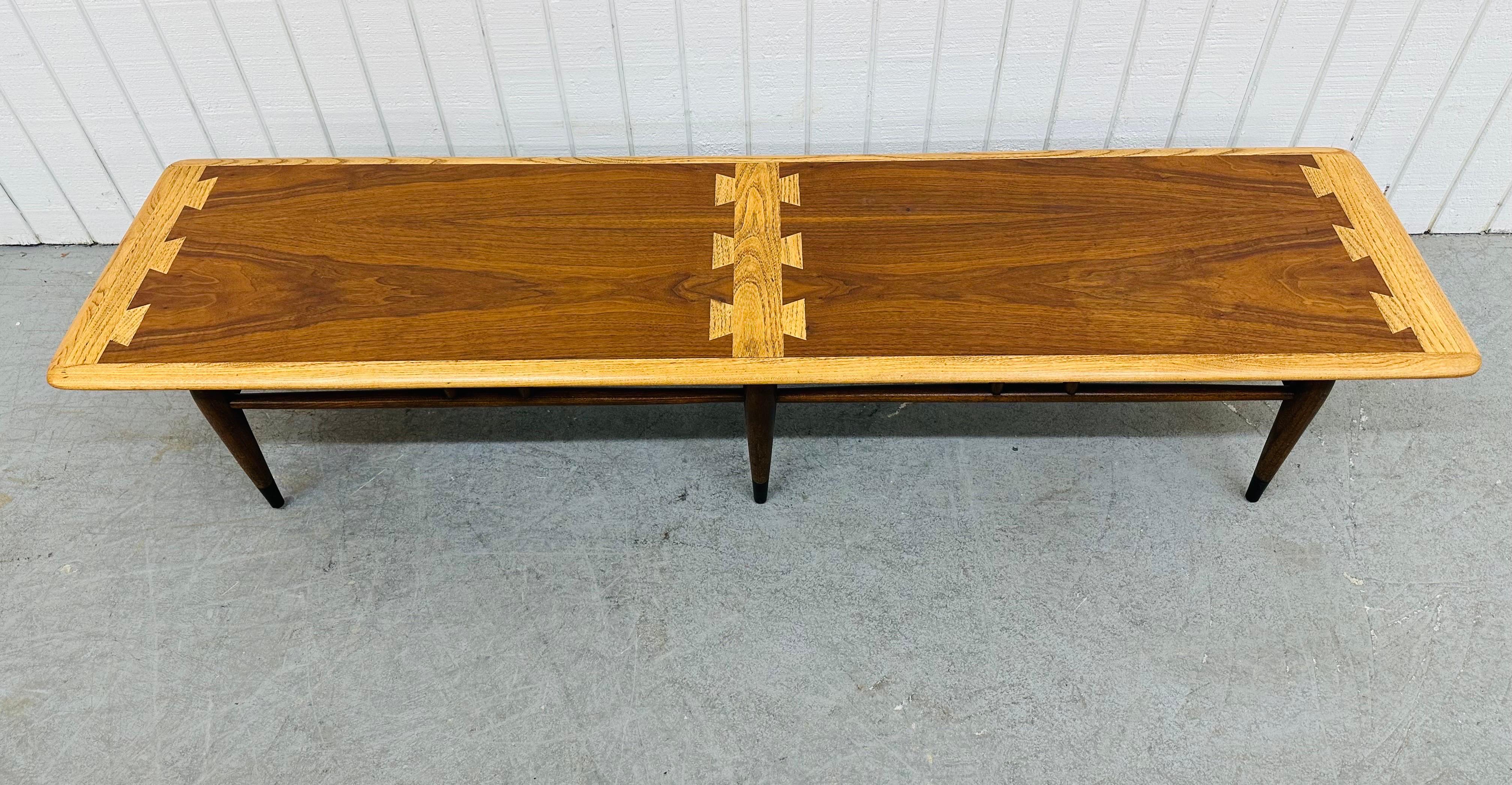This listing is for a Mid-Century Modern Lane Acclaim Walnut Coffee Table. Featuring a straight line rectangular design, iconic dovetailed top, six legs with stretchers, and a beautiful walnut finish. This is an exceptional combination of quality