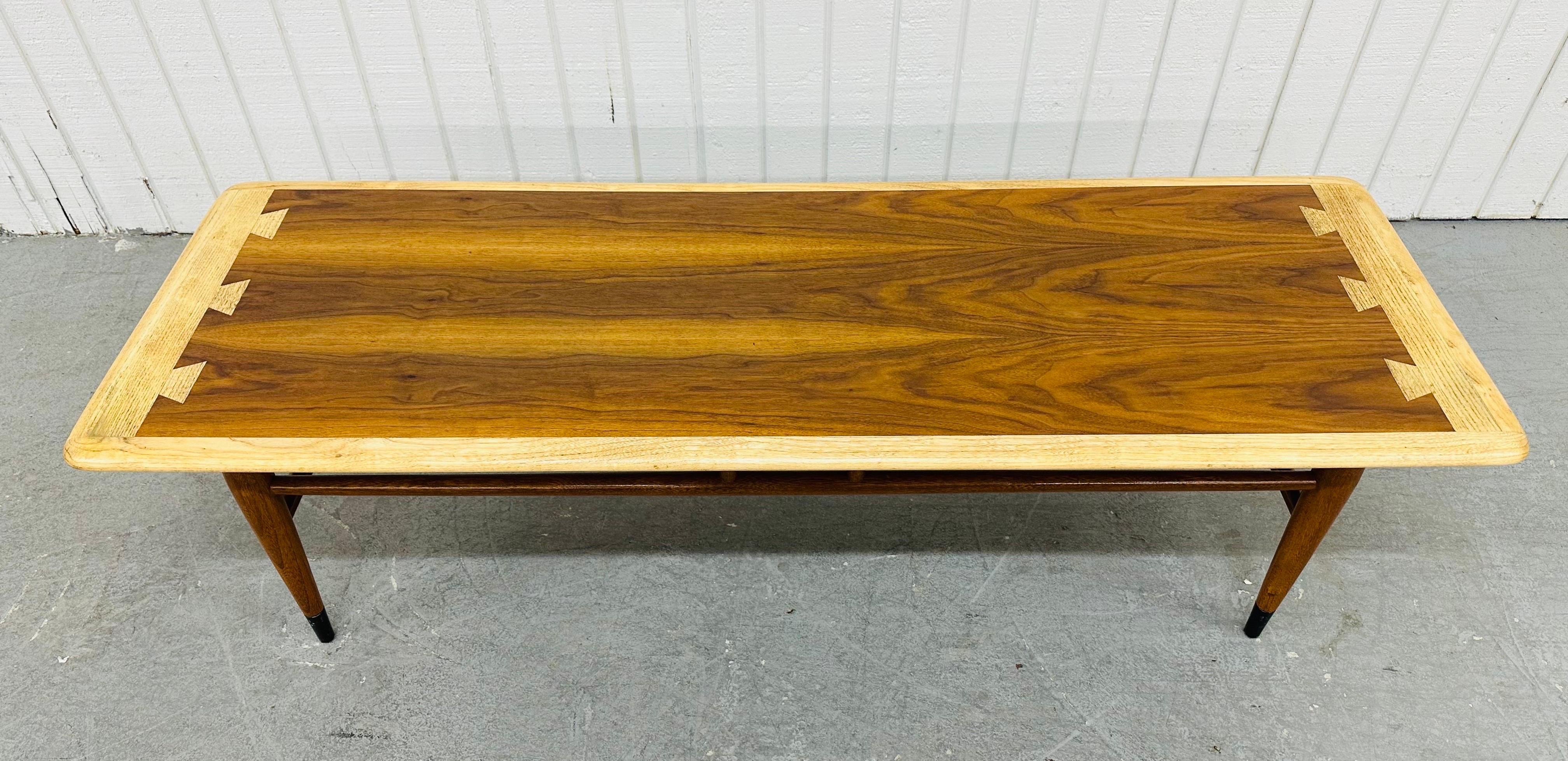 This listing is for a Mid-Century Modern Lane Acclaim Walnut Coffee Table. Featuring a rectangular dovetailed top, modern legs with stretchers, black tips on the legs, and a beautiful two-tone walnut finish. This is an exceptional combination of