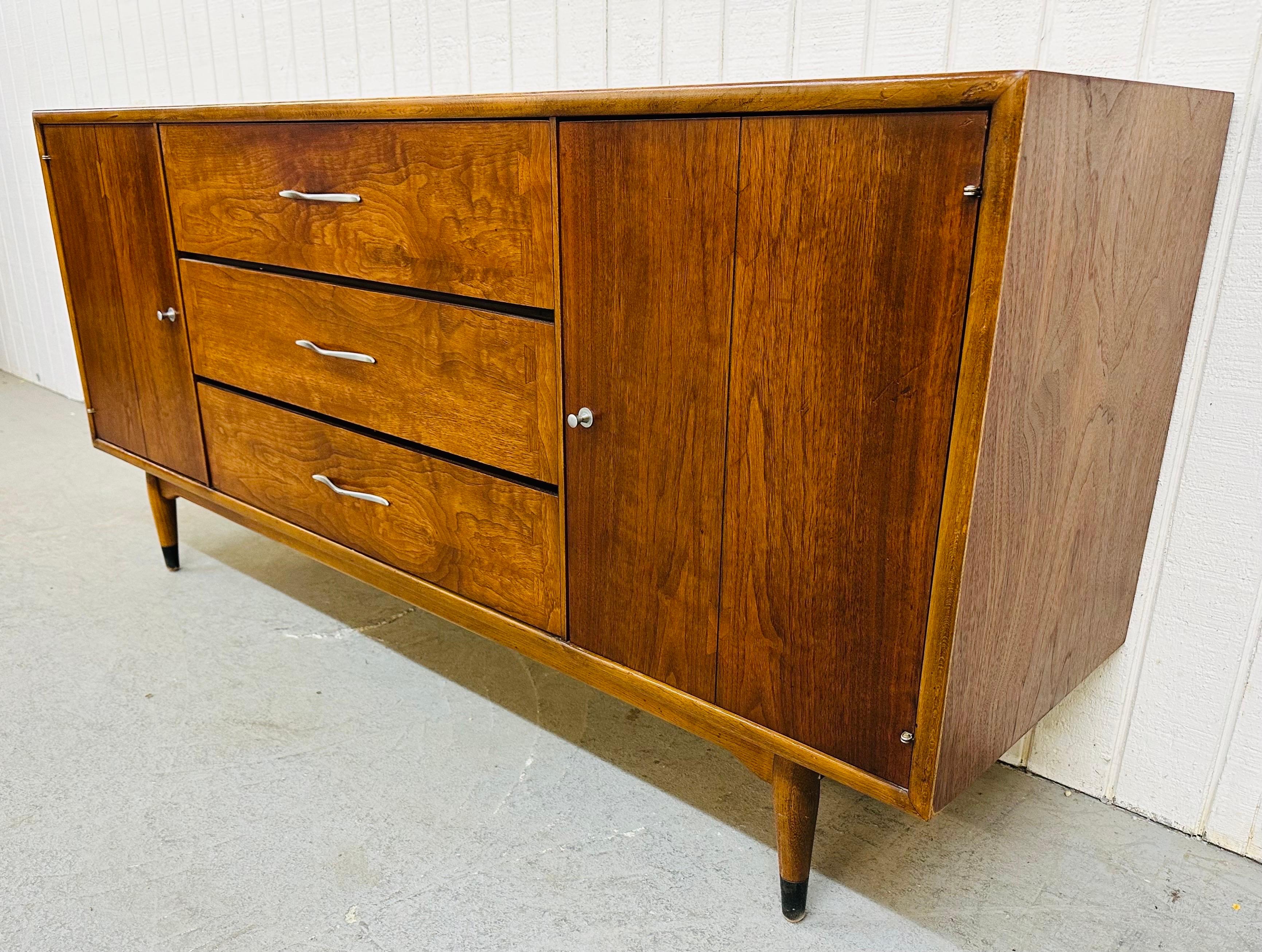 This listing is for a Mid-Century Modern Lane Acclaim Walnut Sideboard. Featuring a straight line design, beautiful walnut rectangular top, two doors that open up to storage space, three large drawers in the center, and original chrome hardware.