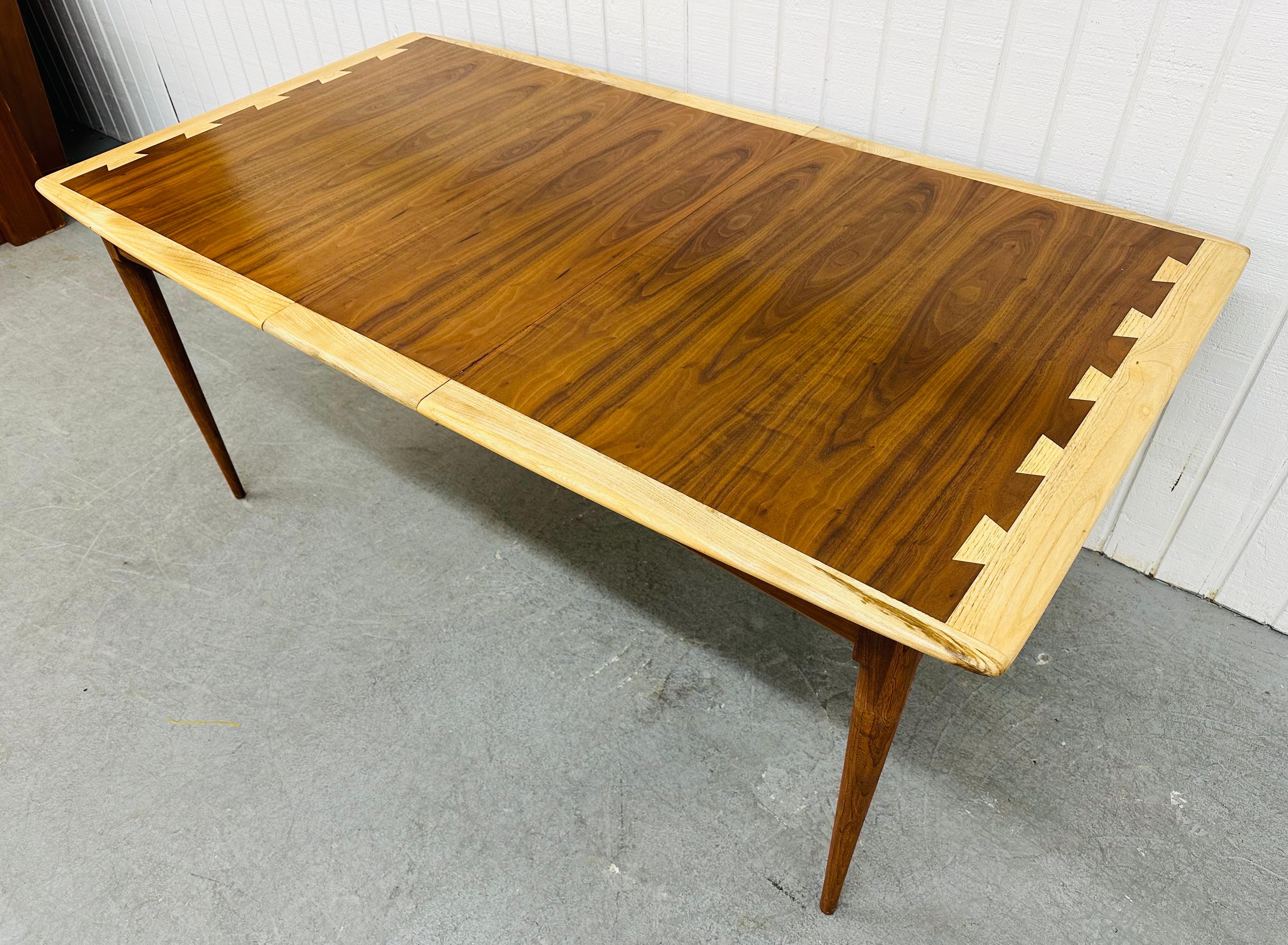 This listing is for a Mid-Century Modern Lane Acclaimed Walnut Dining Table. Featuring a rectangular top, four removable modern legs, one leaf to extend the table up to 68” L, the iconic Lane Acclaimed dovetailed top, and a beautiful walnut finish.