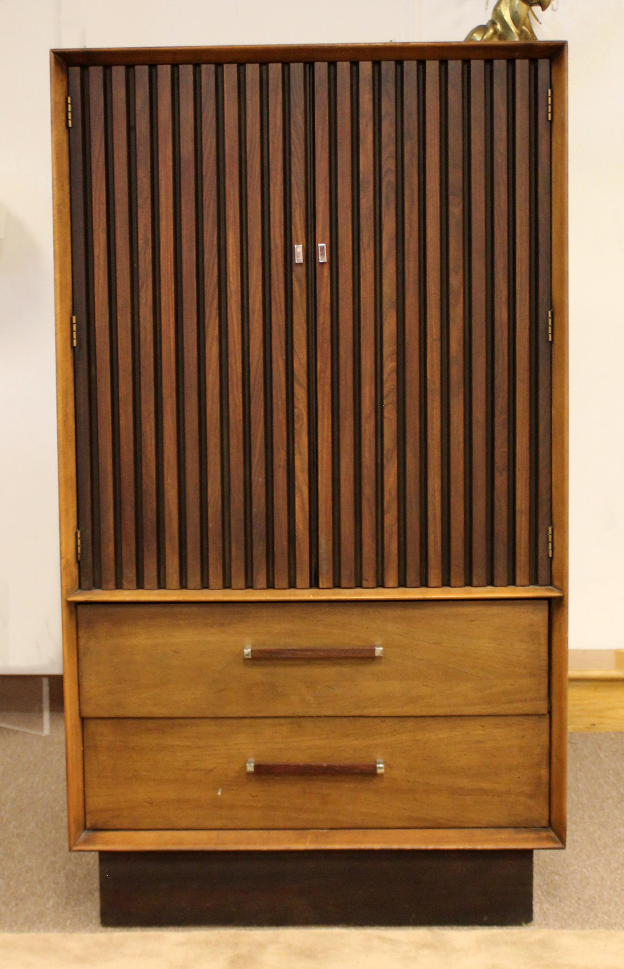 For your consideration is an fabulous, ribbed pecan and rosewood, four drawer highboy dresser, by Lane Altavista, circa 1971. In very good vintage condition. The dimensions are 34