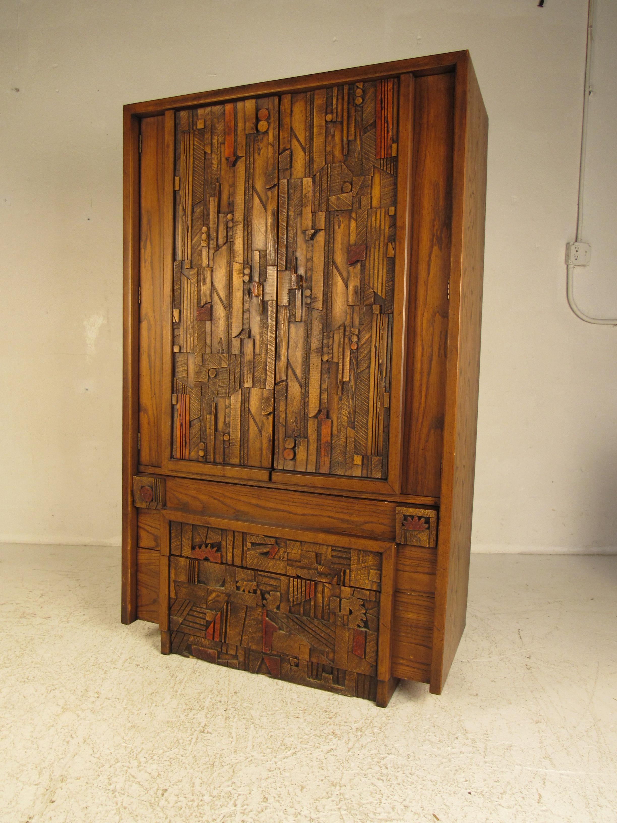 This stunning vintage modern bedroom suite includes a low dresser, an armoire, a mirror, two nightstands, and an arched headboard. A colorful brutalist design with lovely oak wood grain throughout. The unique carved fronts, straight lines, and