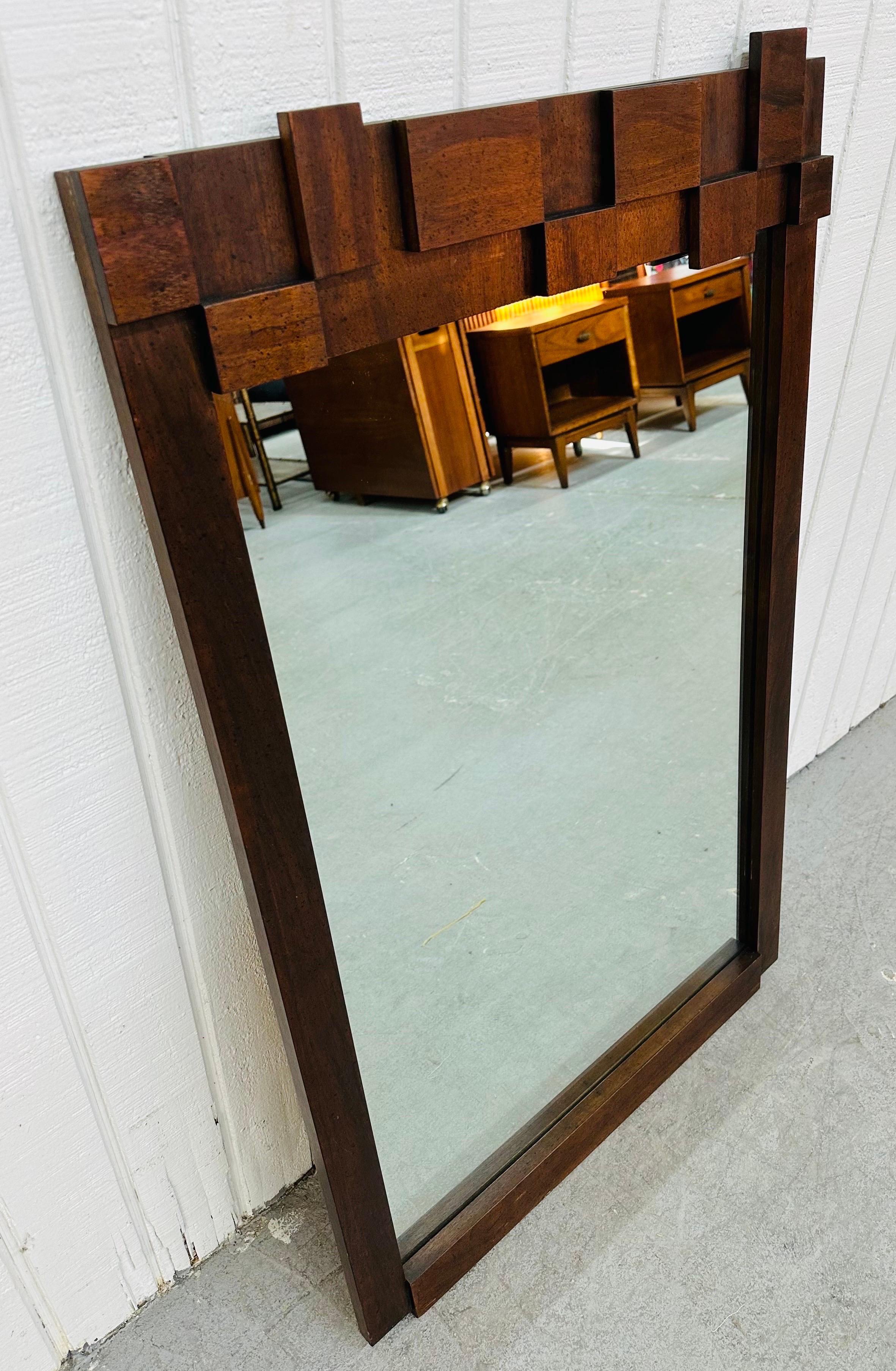This listing is for a Mid-Century Modern Lane Brutalist Walnut Wall Mirror. Featuring a straight line rectangular design, brutalist block front top, walnut frame, and original mirror. This is an exceptional combination of quality and design by Lane!