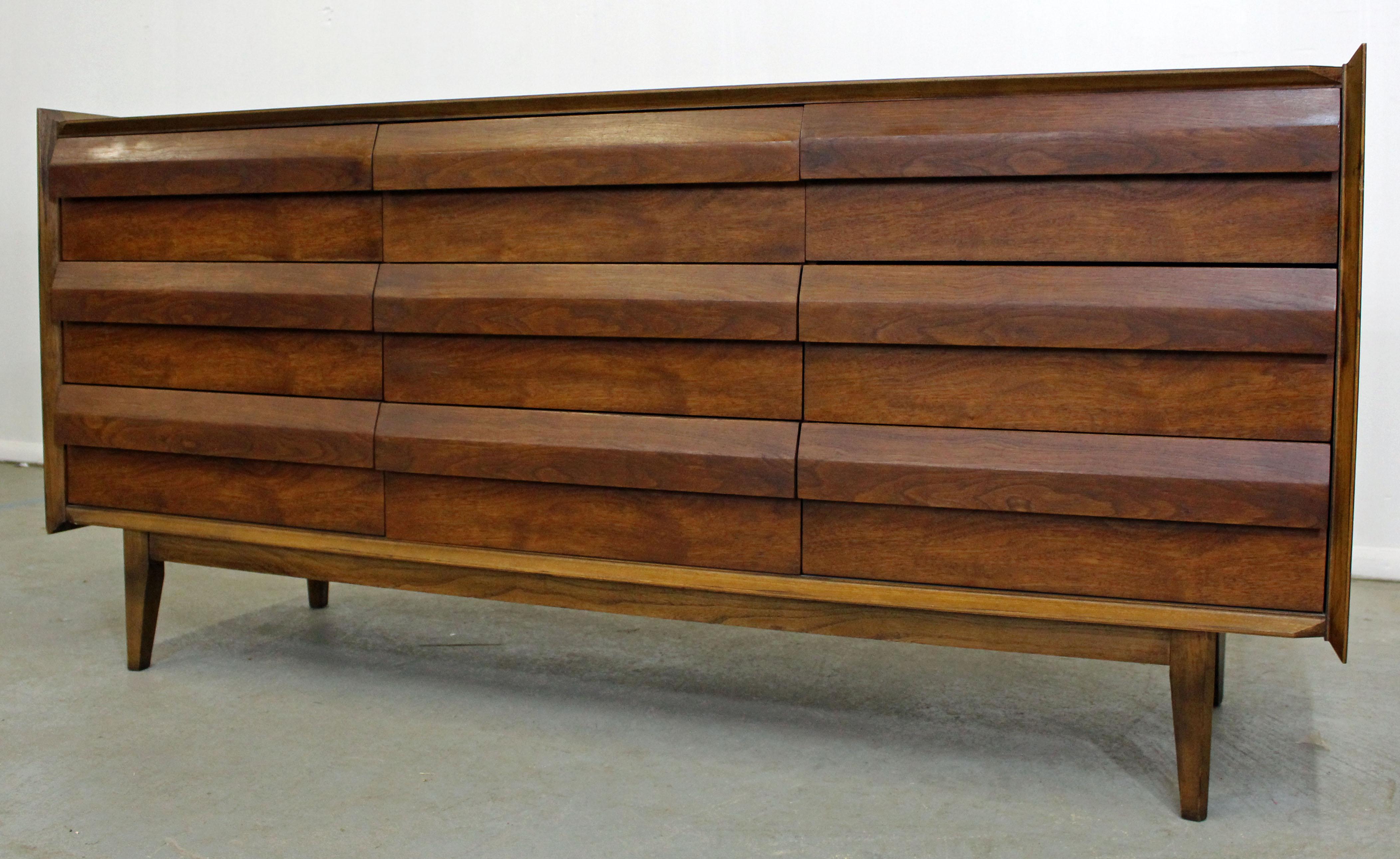 Offered is a Mid-Century Modern credenza or dresser, made by Lane 