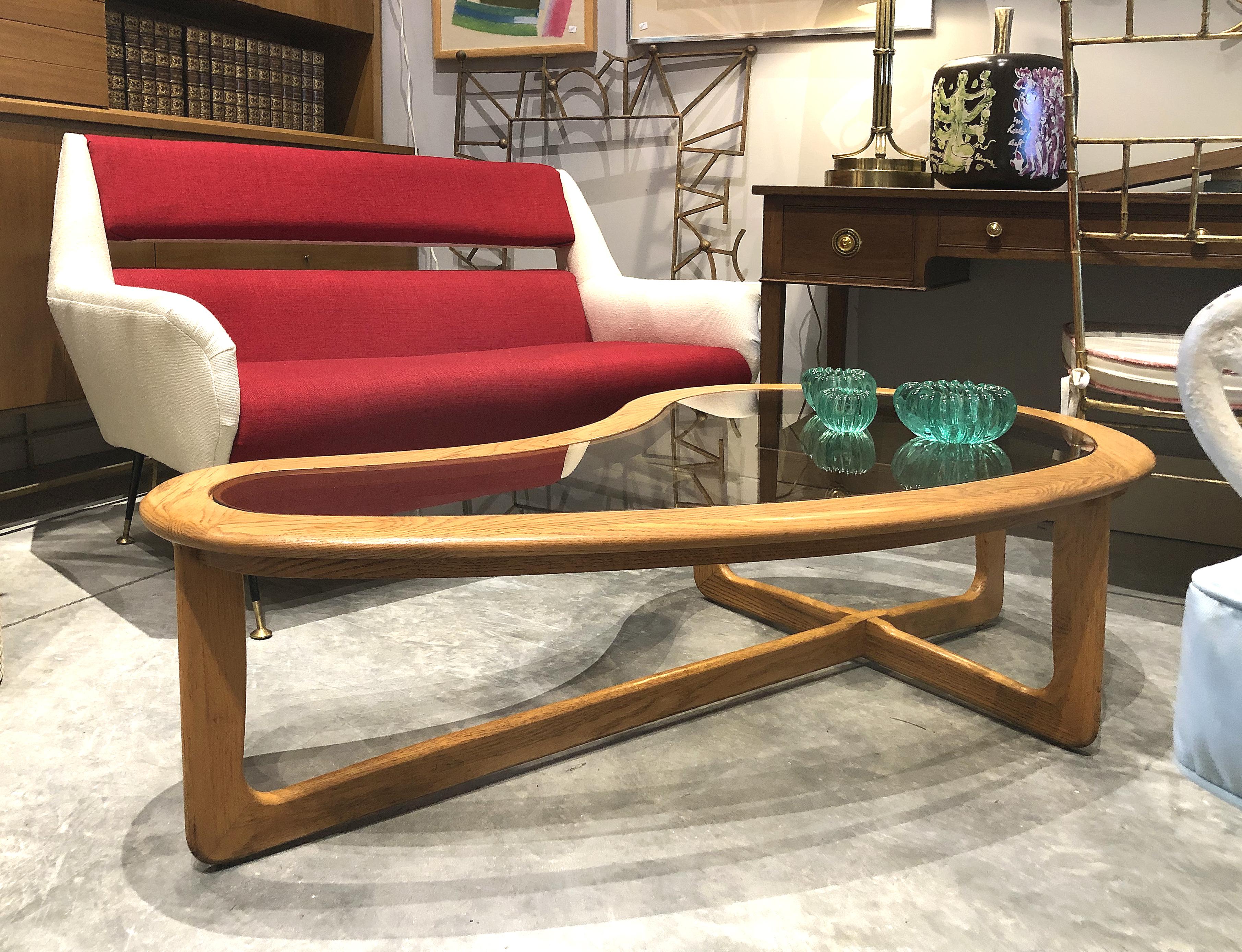 Mid-Century Modern Lane Kidney Shaped Boomerang Walnut and Glass Coffee Table

Offered for sale is a Mid-Century Modern vintage Lane kidney shaped boomerang walnut and glass coffee table.
This 1960s sculptural coffee table is made by Lane Furniture