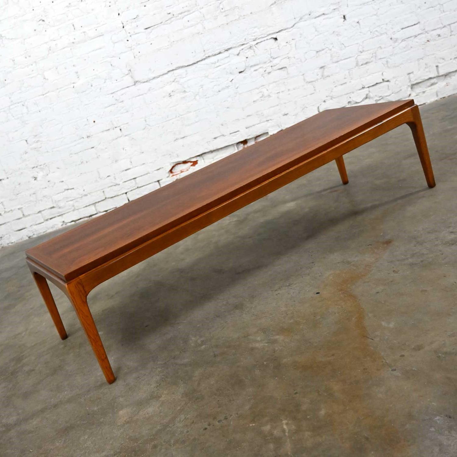 Handsome Mid-Century Modern Lane Rhythm Collection long narrow rectangular walnut coffee table. Beautiful condition, keeping in mind that this is vintage and not new so will have signs of use and wear. The top has been refinished. Also note color