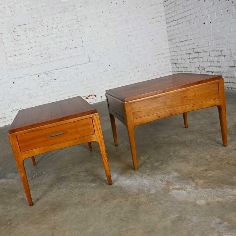 Classic Mid-Century Modern pair of end tables by Lane Furniture for their Rhythm Collection comprised of walnut and brass plated metal hardware. Beautiful condition, keeping in mind that these are vintage and not new so will have signs of use and