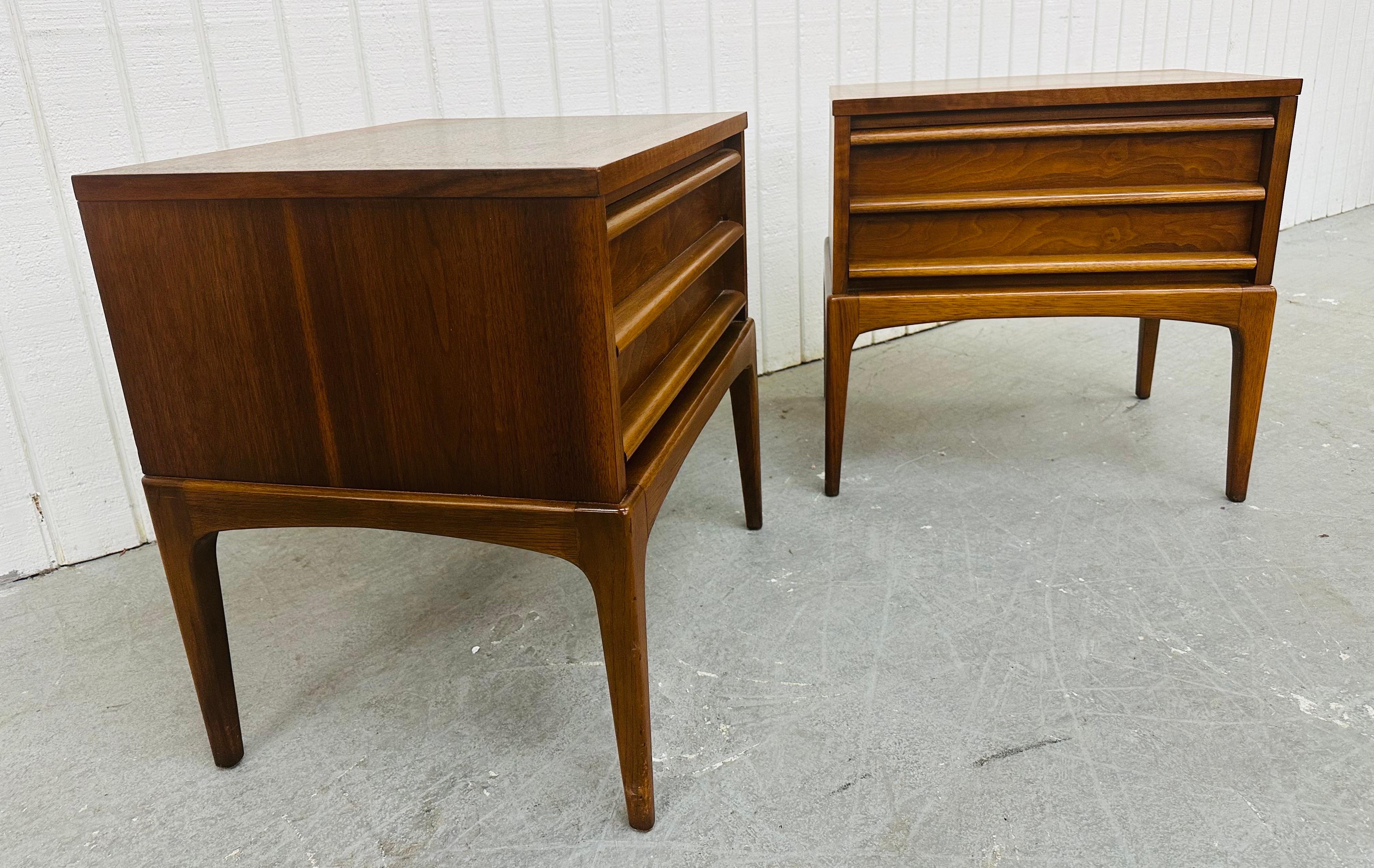 This listing is for a pair of Mid-Century Modern Lane Rhythm Walnut Nightstands. Featuring a straight line design, rectangular walnut tops, large single drawer with wooden pulls, modern legs, and a beautiful walnut finish! This is an exceptional