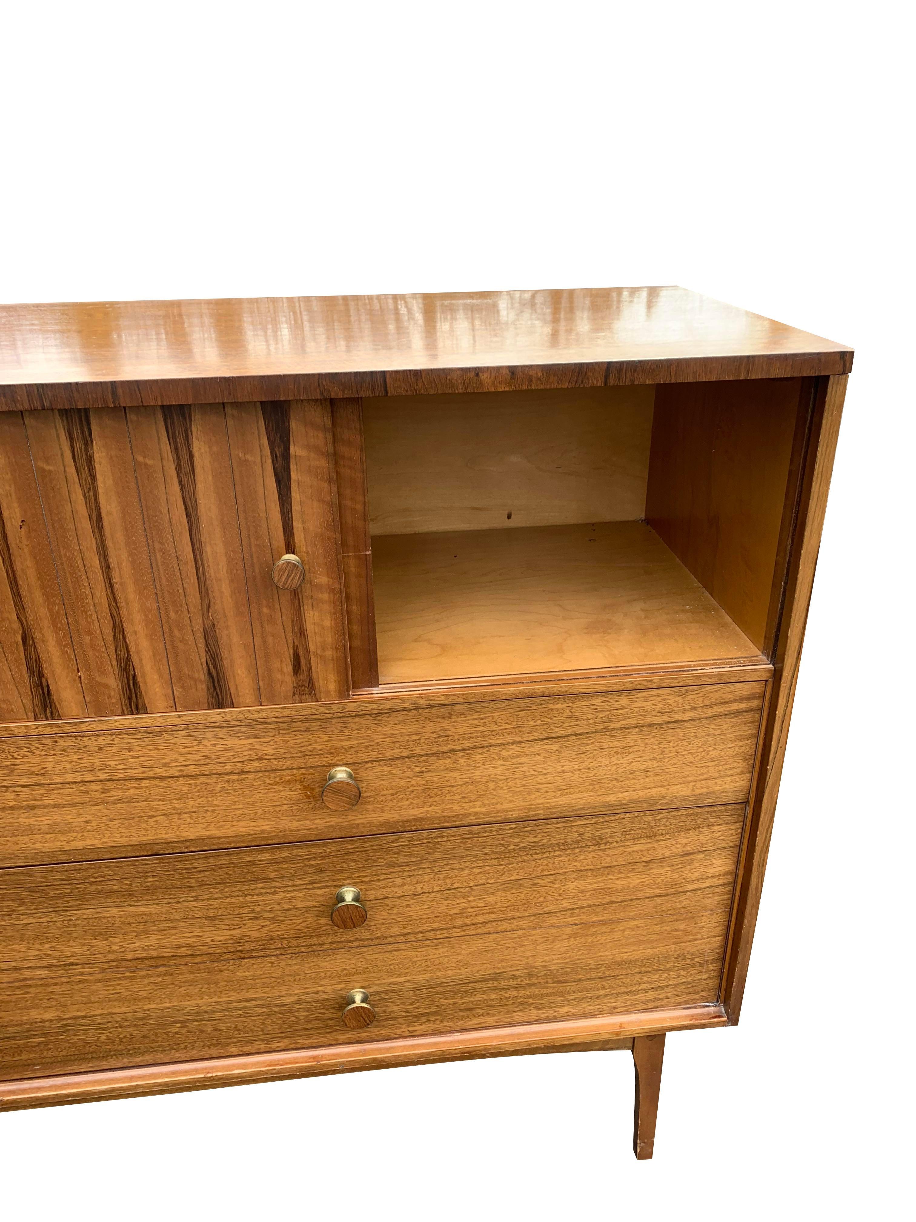 Lane Rosewood and Satinwood High Chest Tall Dresser

Add a touch of mid-century modern elegance to your home with this stunning Lane Rosewood and Satinwood High Chest Tall Dresser. This beautifully crafted piece offers ample storage space for your
