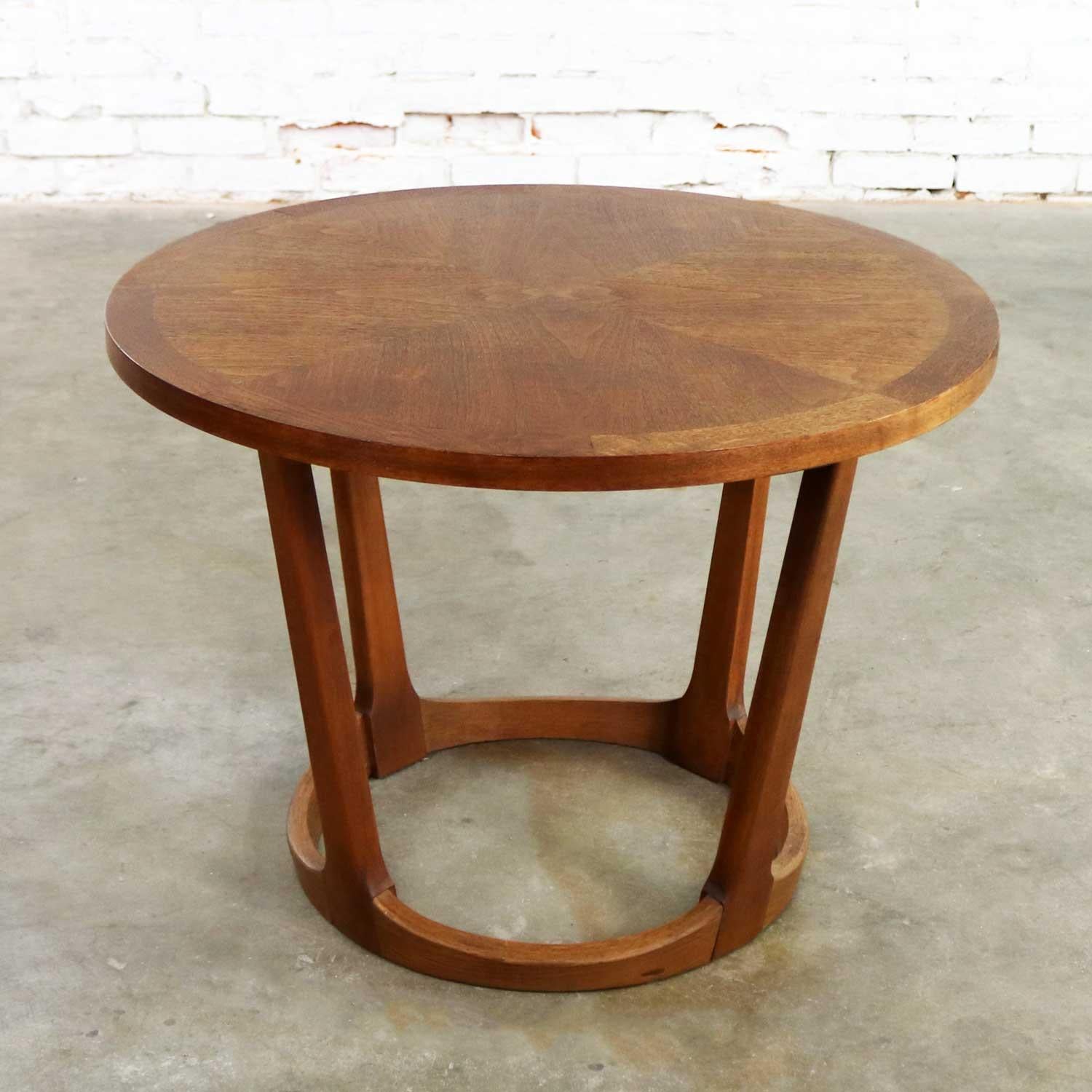 Handsome Mid-Century Modern round end table in walnut from the Rhythm collection by Lane furniture. In their brochure as drum table 997-22. It retains its original makers mark as well as model number 997.22 and serial number 2862160 which denotes