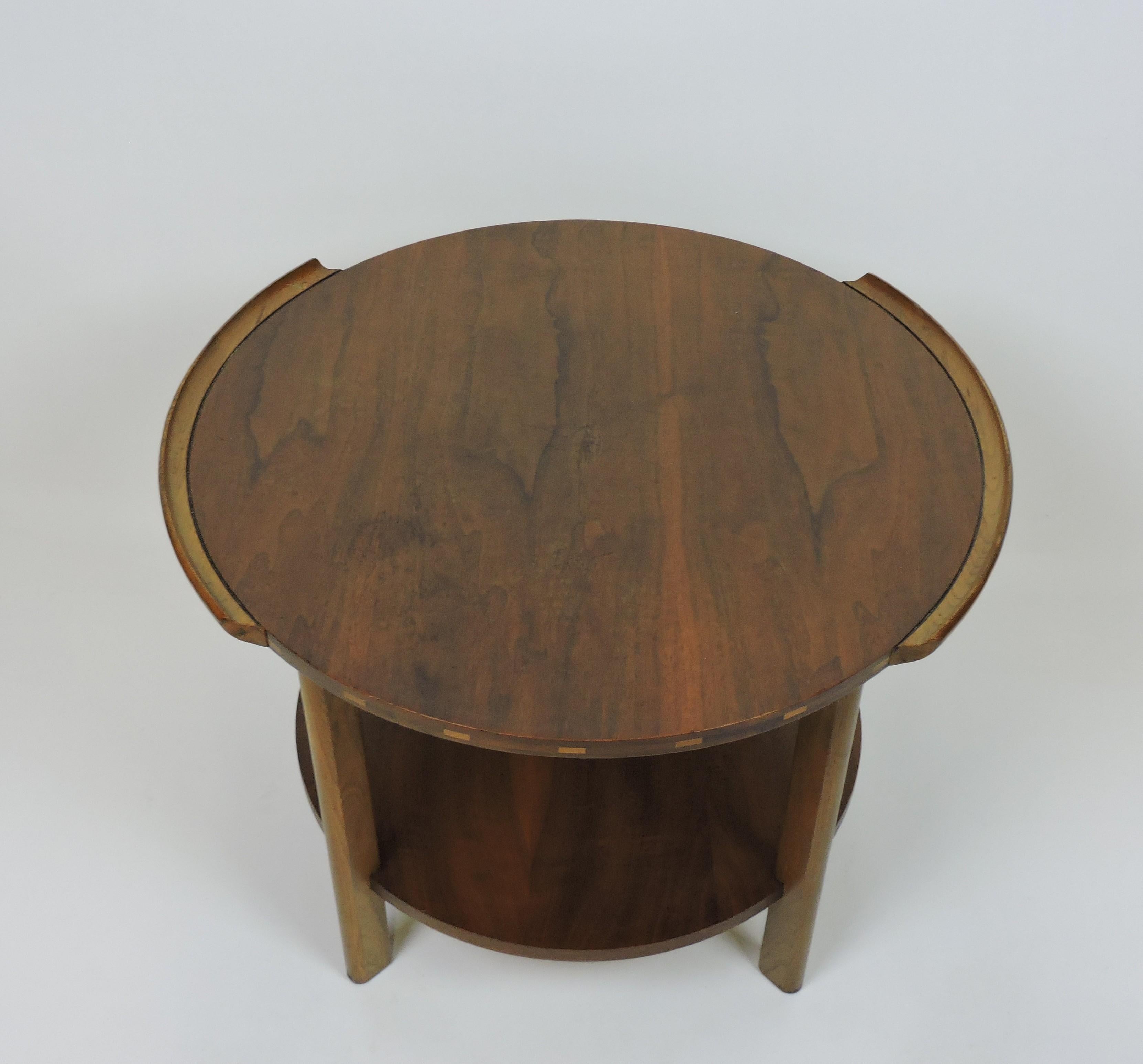 Attractive side or small coffee table manufactured by the Lane Furniture Company of Altavista, Virginia as part of their Vogue series. This two tiered table has an Asian influenced style with its two raised edges and contrasting wood inlays on the