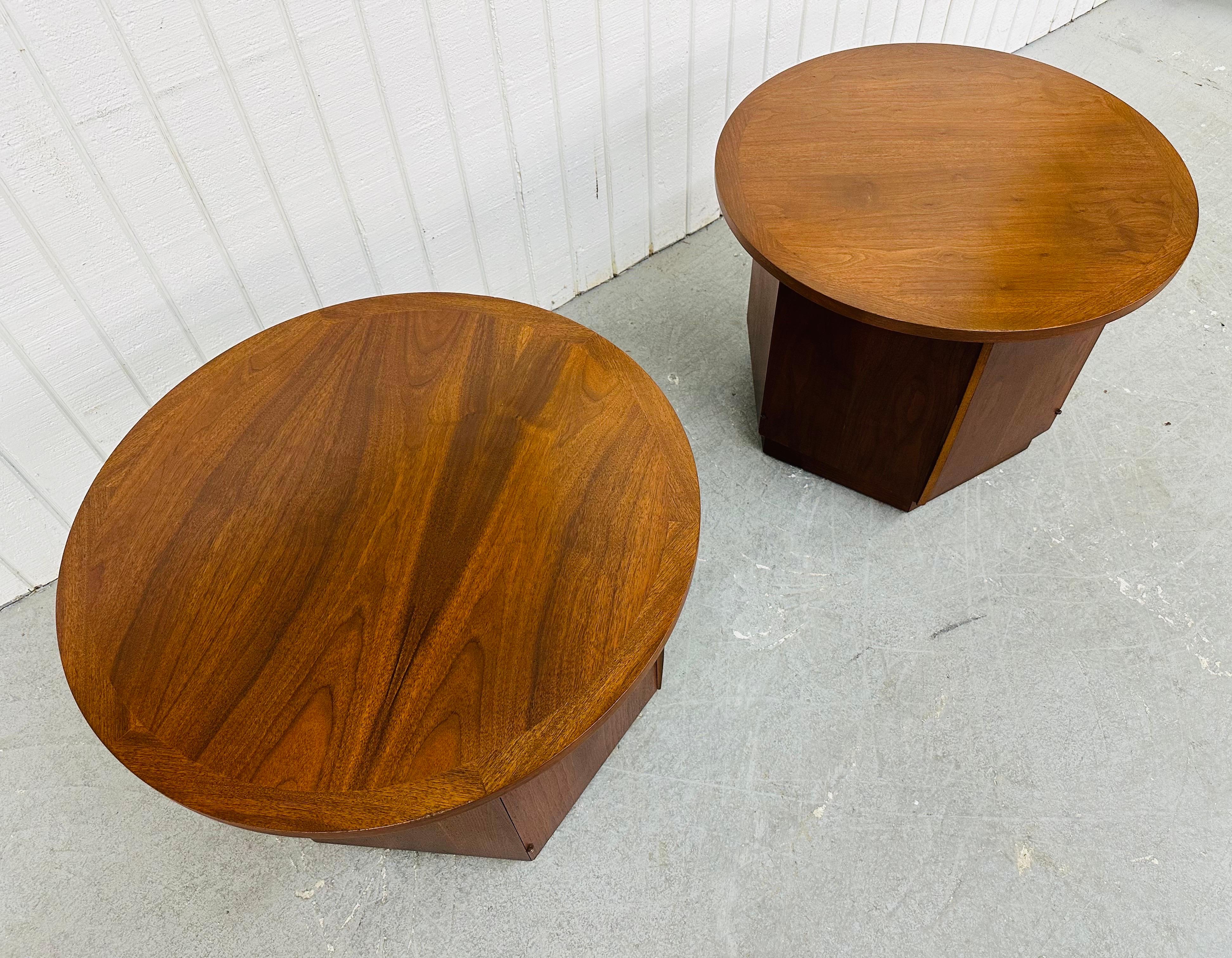 This listing is for a pair of Mid-Century Modern Lane Round Walnut Side Tables. Featuring a round walnut top, hexagonal designed base, single door that opens up to storage space, and a beautiful walnut finish. This is an exceptional combination of