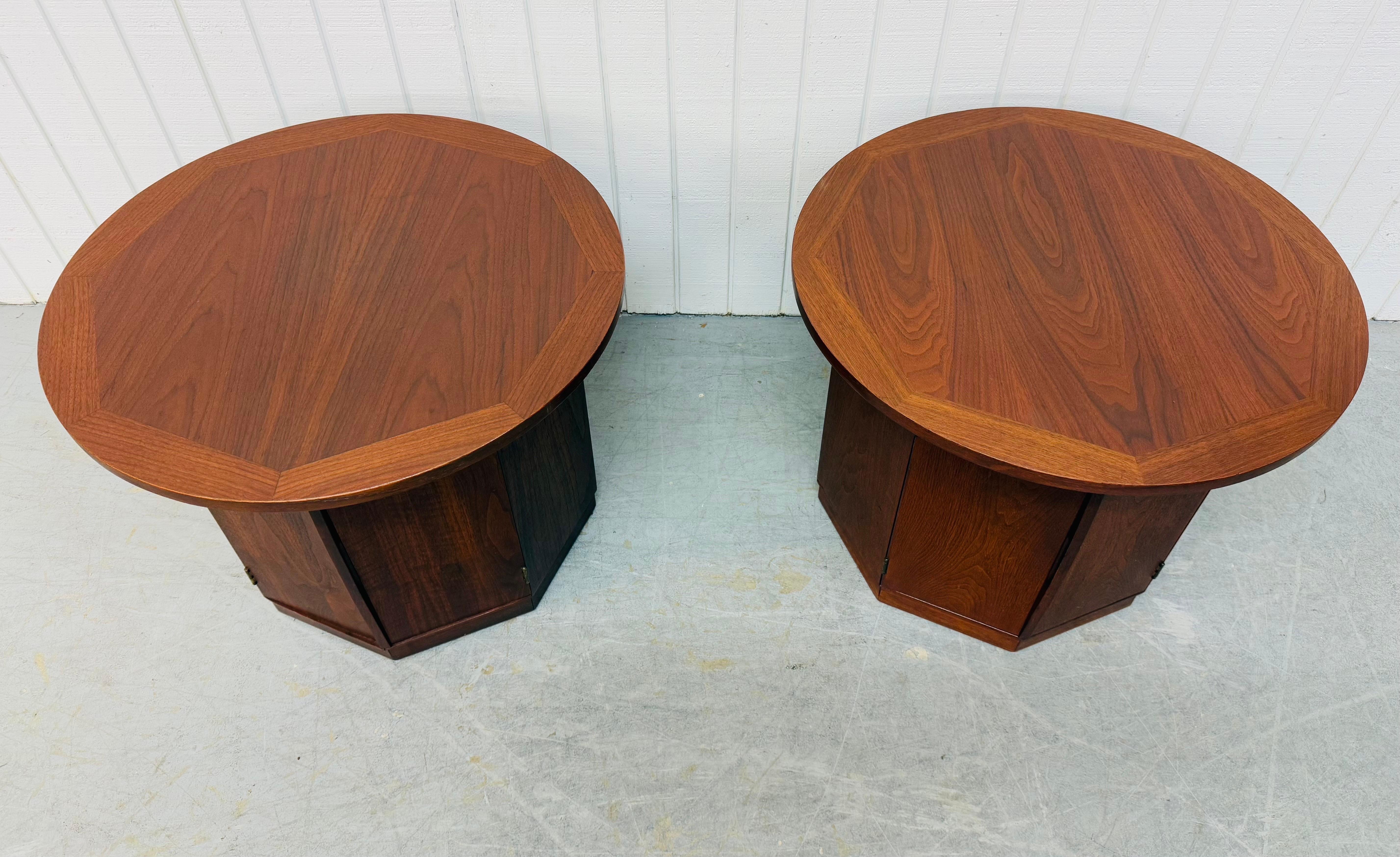 This listing is for a pair of Mid-Century Modern Lane Round Walnut Side Tables. Featuring a round top, hexagonal base, single door that opens up to storage space, and a beautiful walnut finish. This is an exceptional combination of quality and MCM